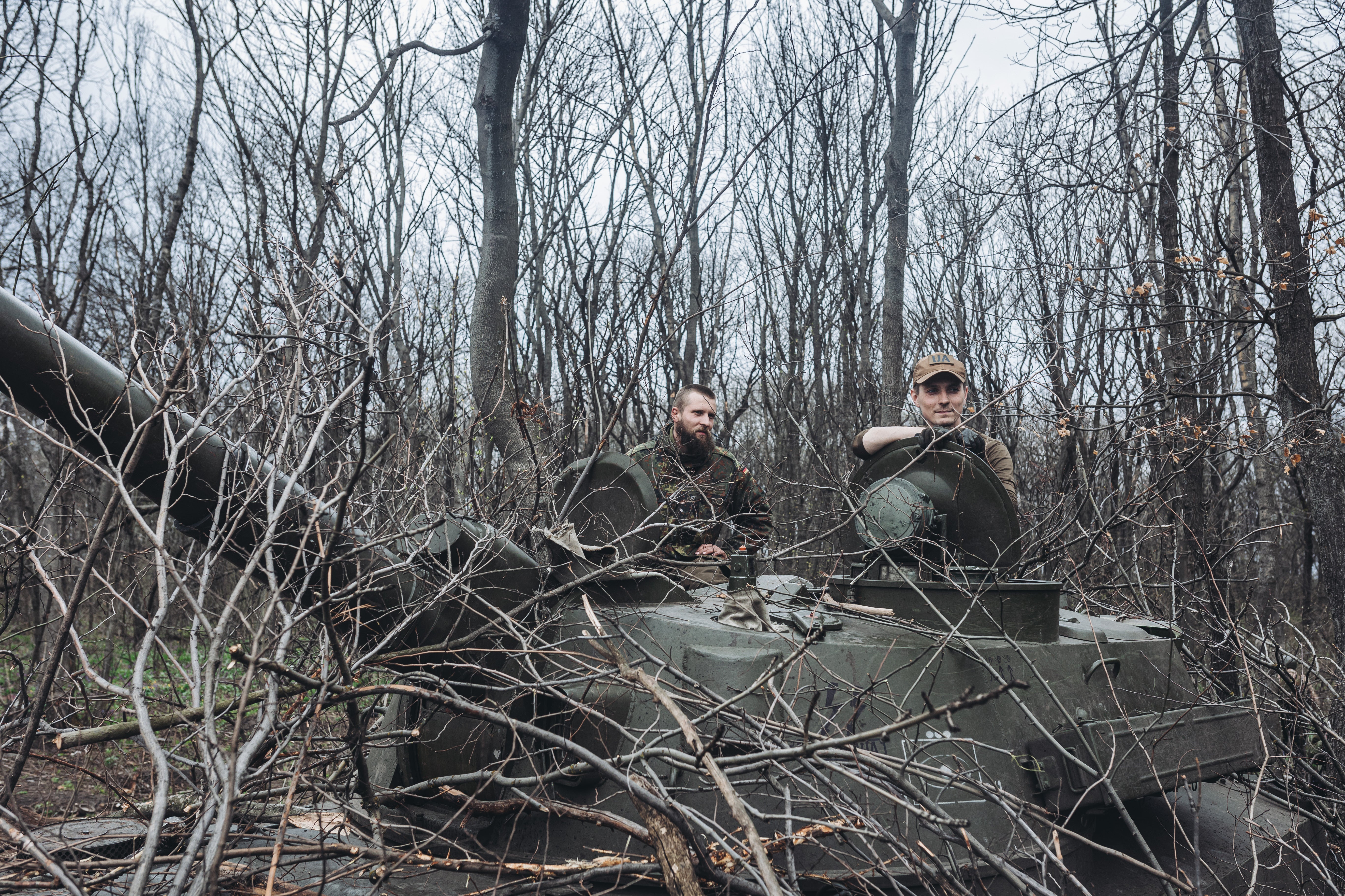 Ukrainian soldiers in a tank on the front line in Donbas