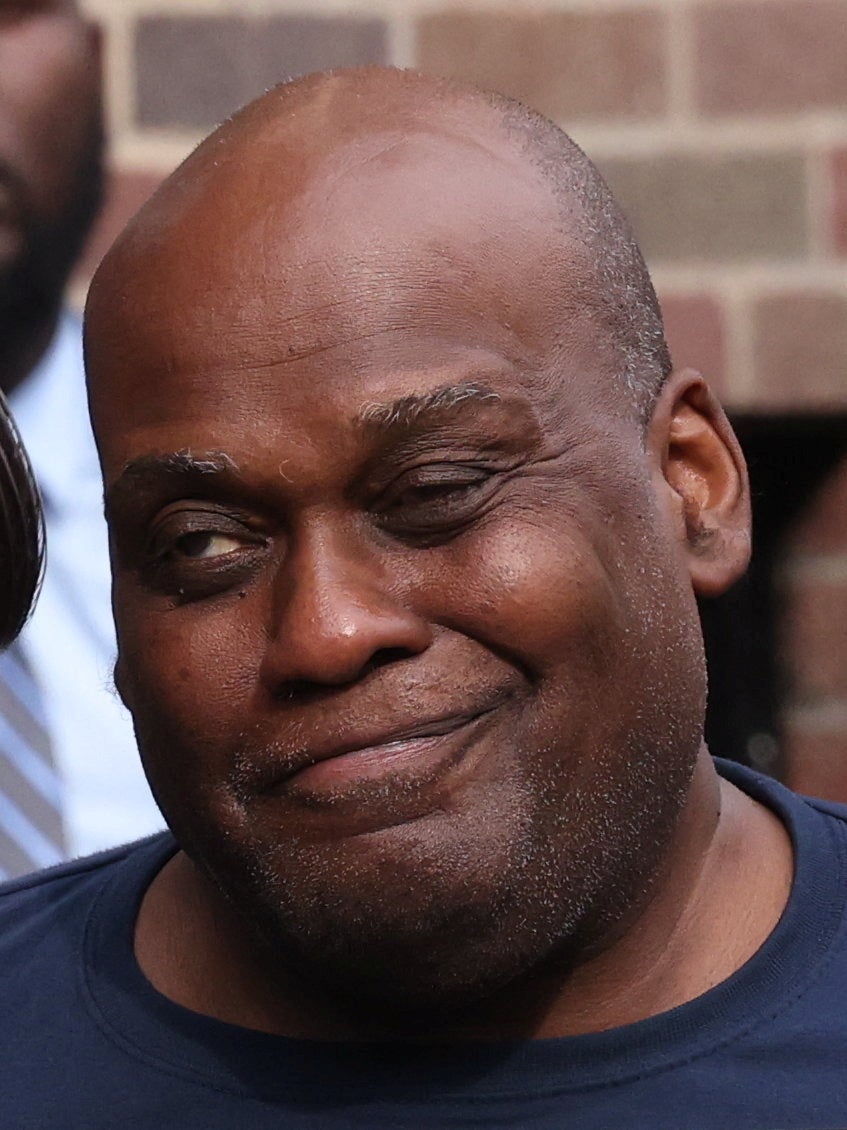 Frank James reacts as he is escorted to a vehicle after leaving an NYPD precinct in Manhattan