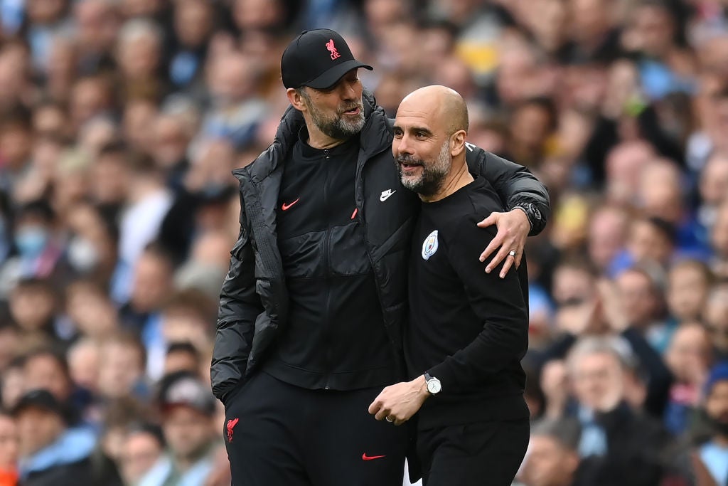 Jurgen Klopp and Pep Guardiola share a joke during Sunday’s Premier League match between Manchester City and Liverpool