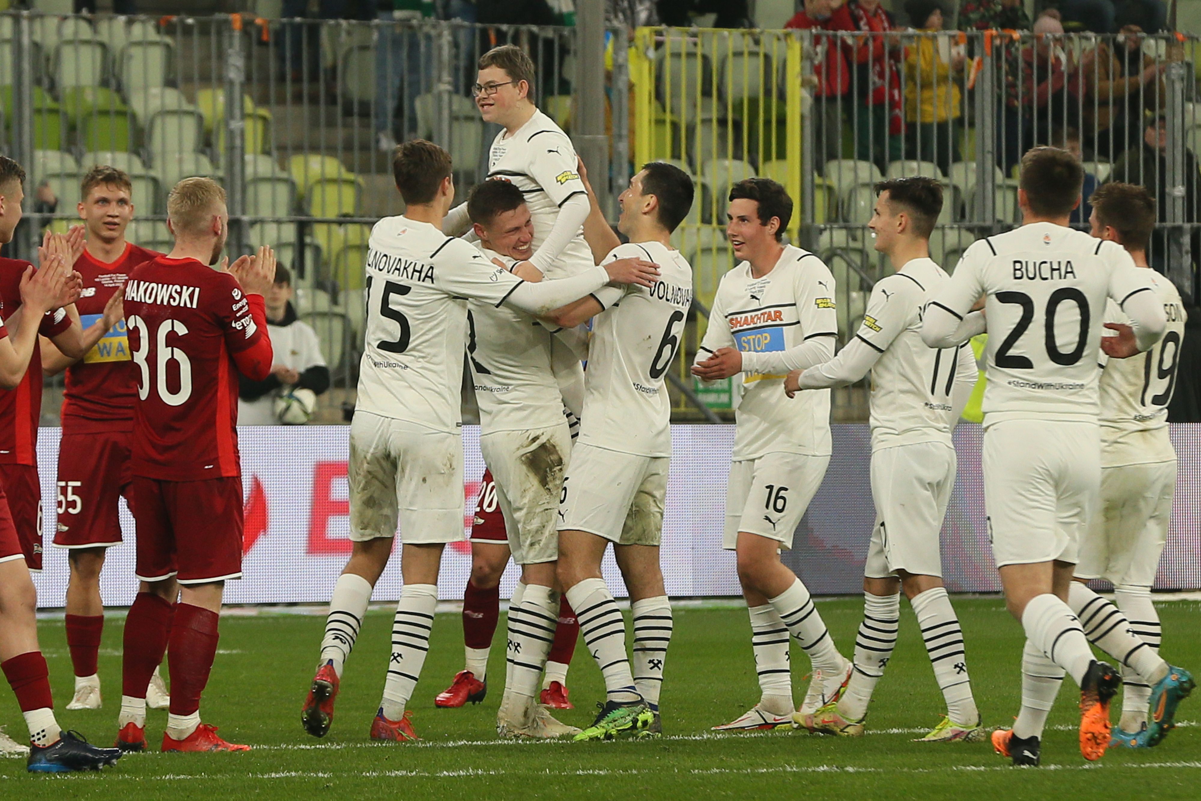 12-year-old Ukrainian refugee Dmytro Keda is hoisted aloft after scoring the winning goal (Shakhtar Donetsk/PA)