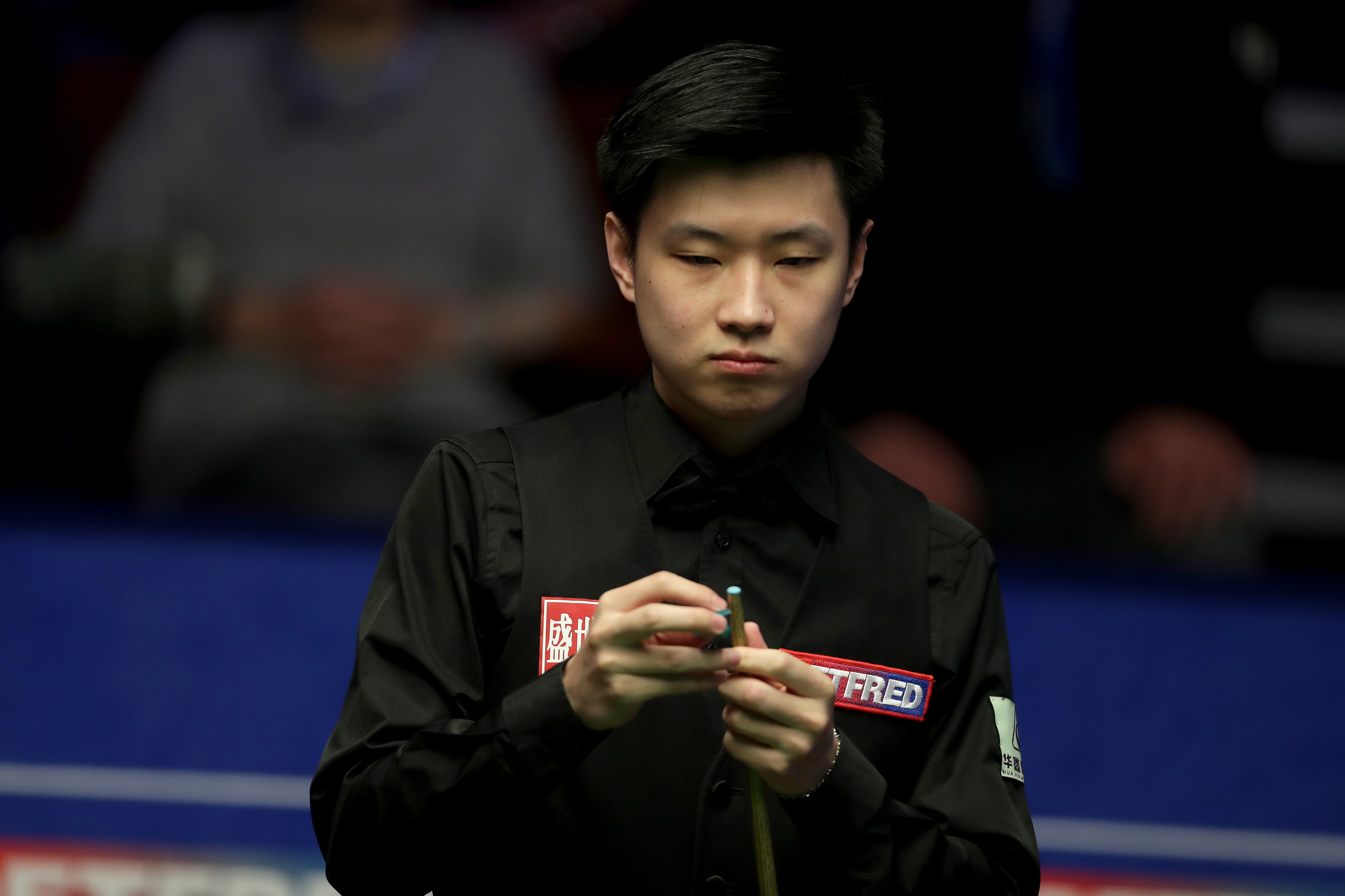 Zhao Xintong is in control of his match against Jamie Clarke (Richard Sellers/PA)