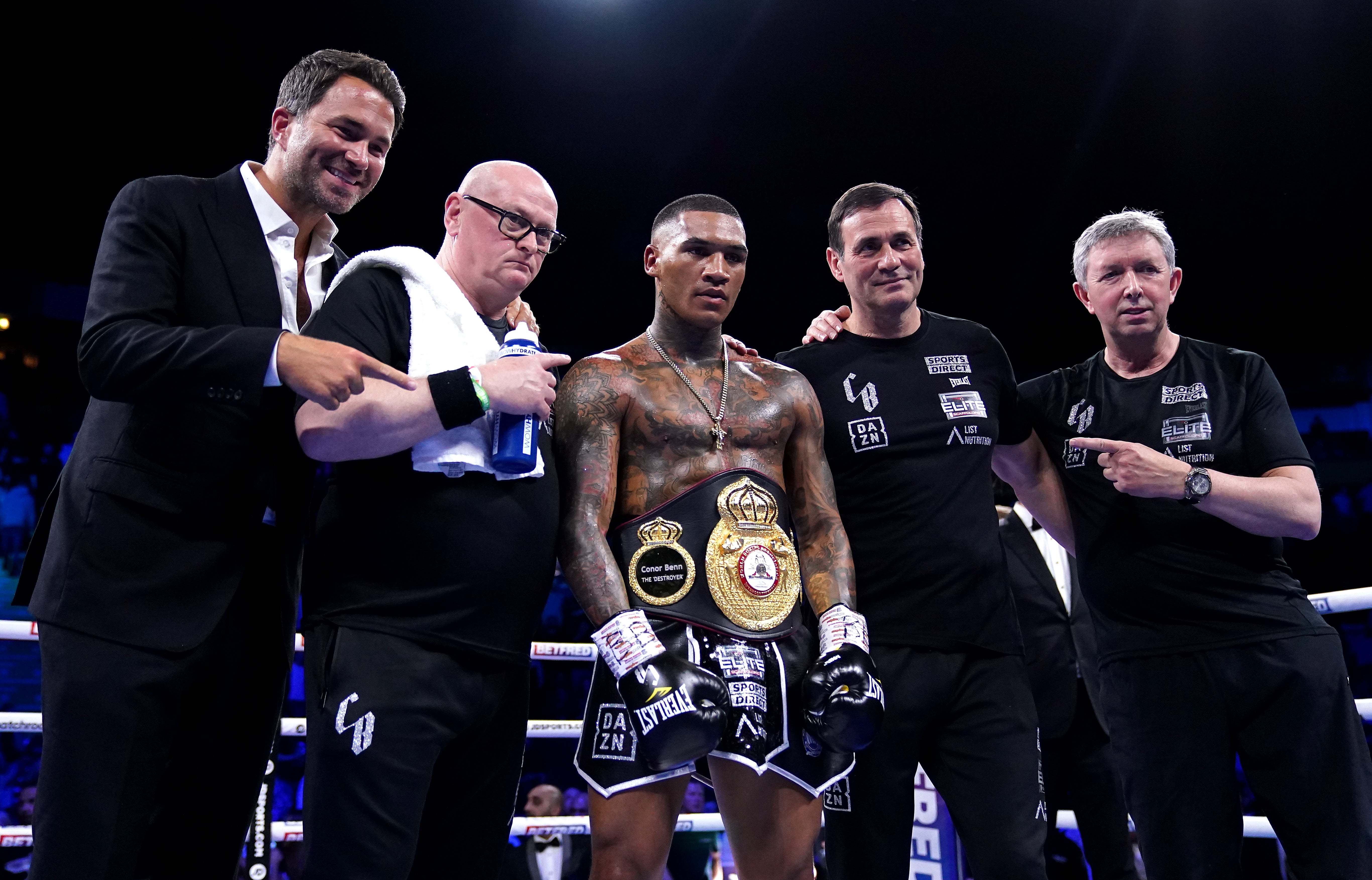 Conor Benn (centre), trainer Tony Sims (second right) and promotor Eddie Hearn (Zac Goodwin/PA)