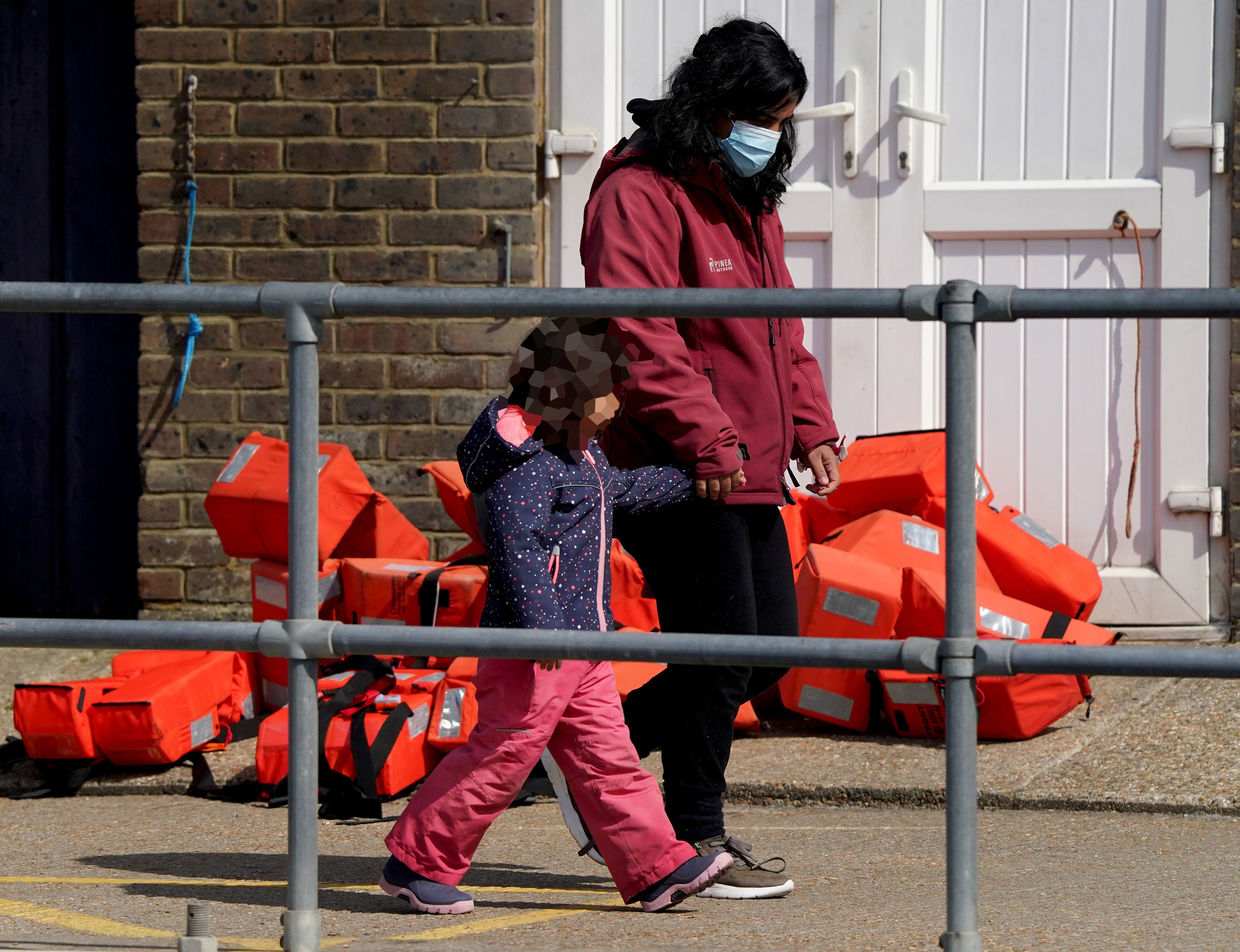 A young girl amongst a group of people thought to be migrants who were brought in to Dover, Kent, following a small boat incident in the Channel last week (Gareth Fuller/PA)