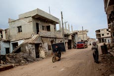 Living in a ruined town on the front line, Syrians know hell on earth