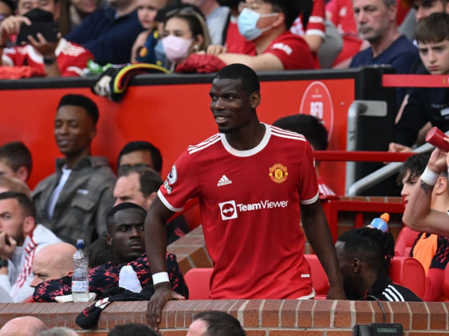 Paul Pogba takes a seat after being booed off by some supporters