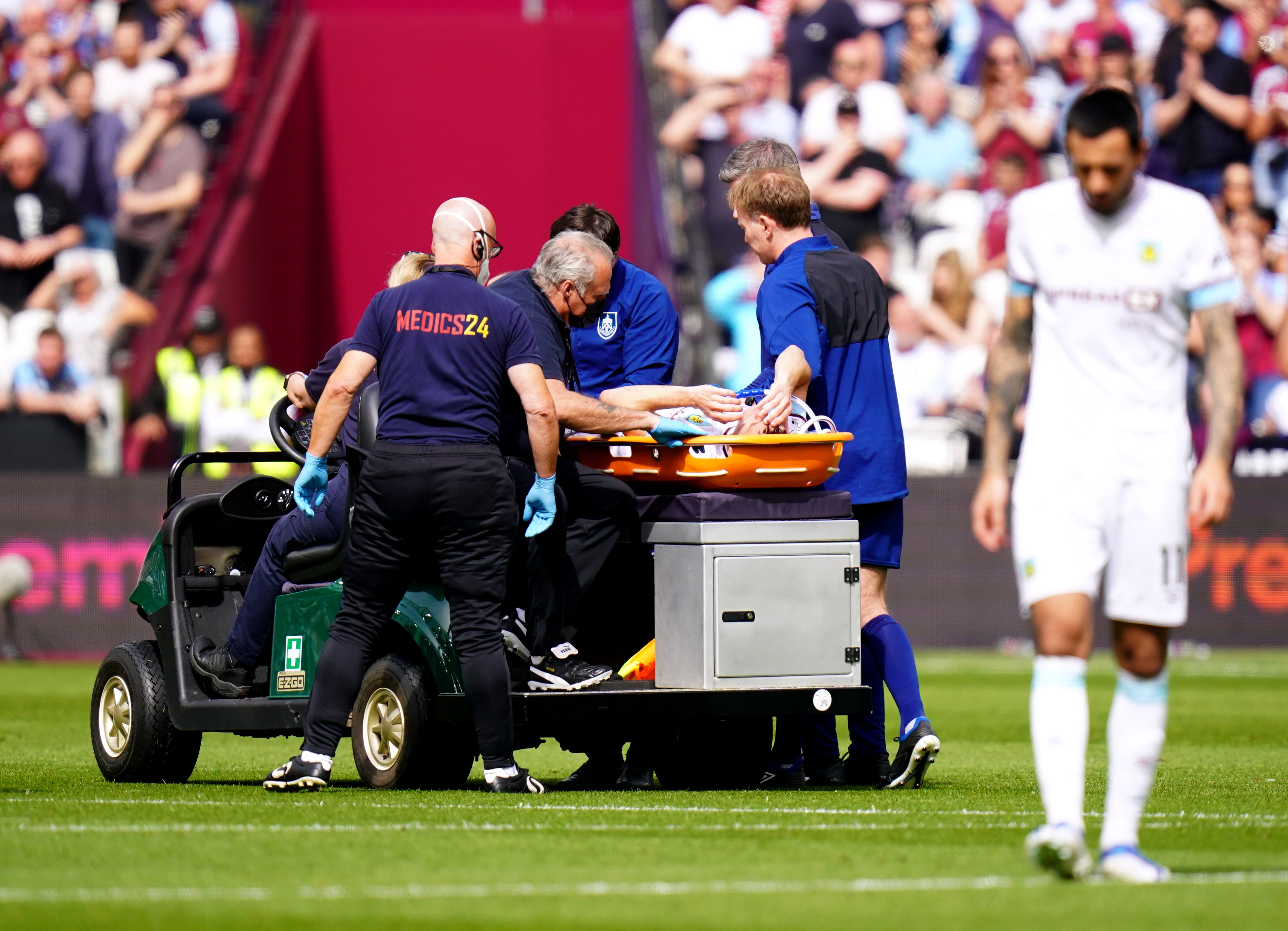 Burnley’s Ashley Westwood leaves the pitch on a stretcher (Adam Davy/PA).