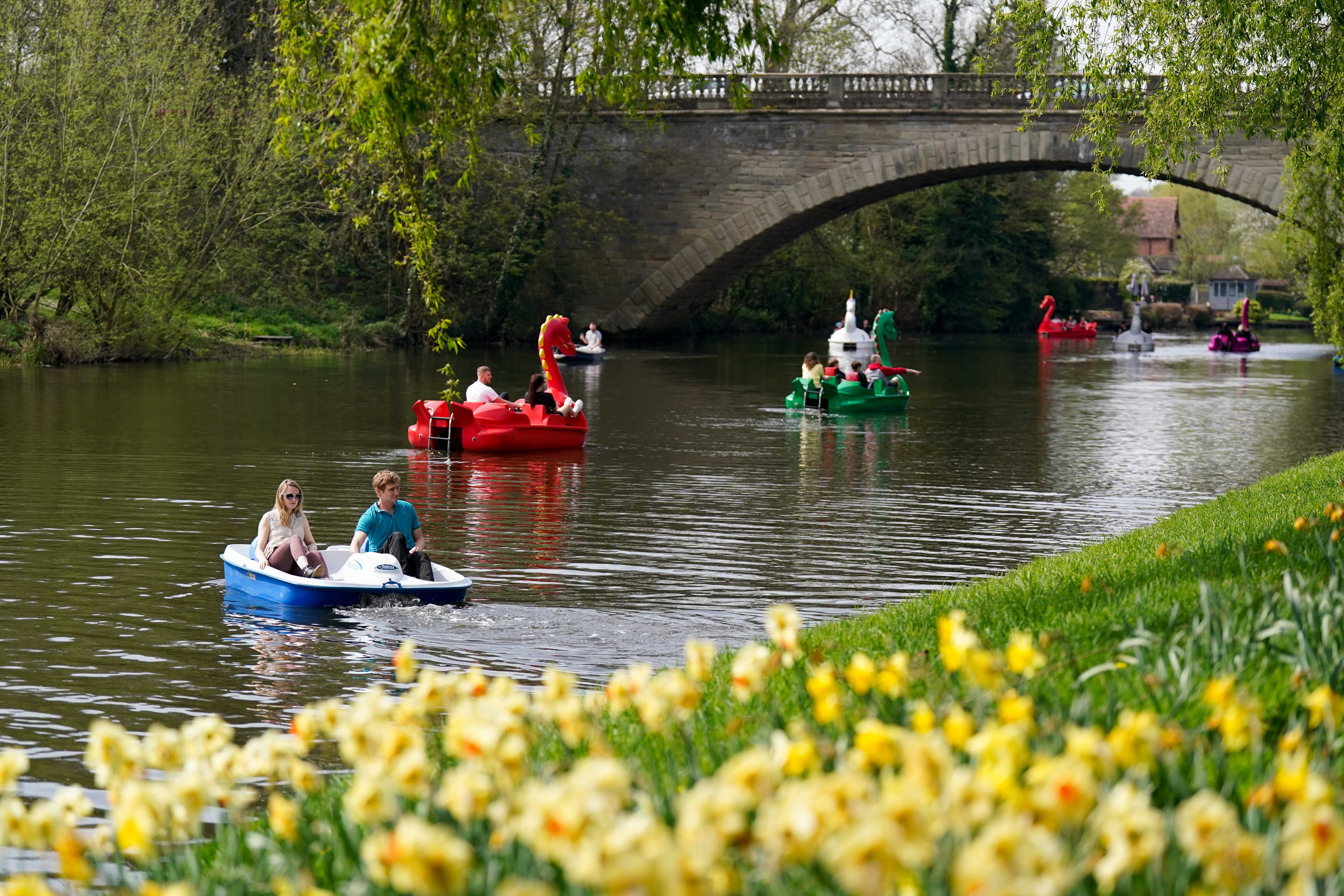 People on the river Avon by St Nicholas’ Park in Warwick (PA)