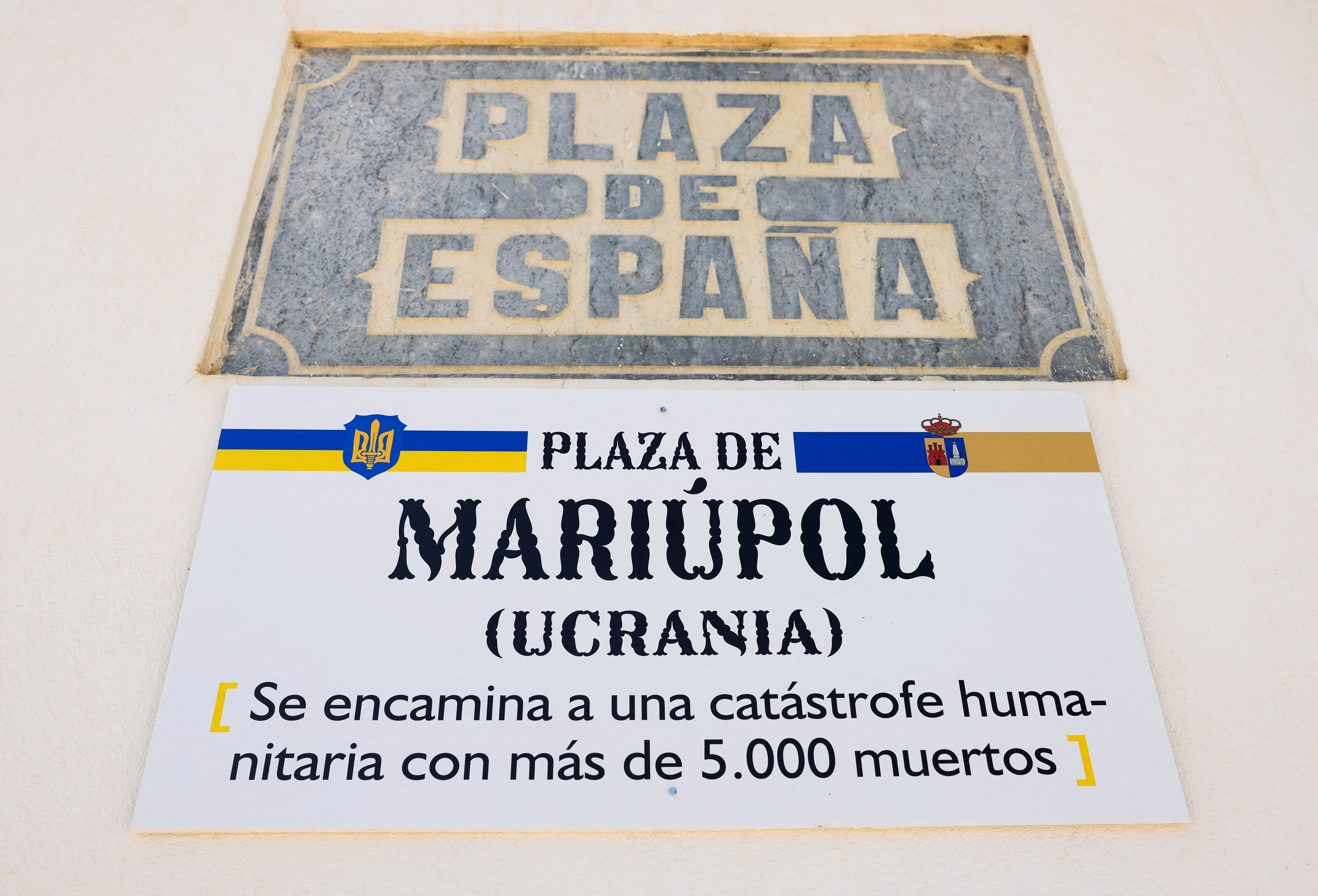 A sign that reads, ‘Square of Mariupol’, is pictured after it was changed from the original name, ‘Square of Spain’