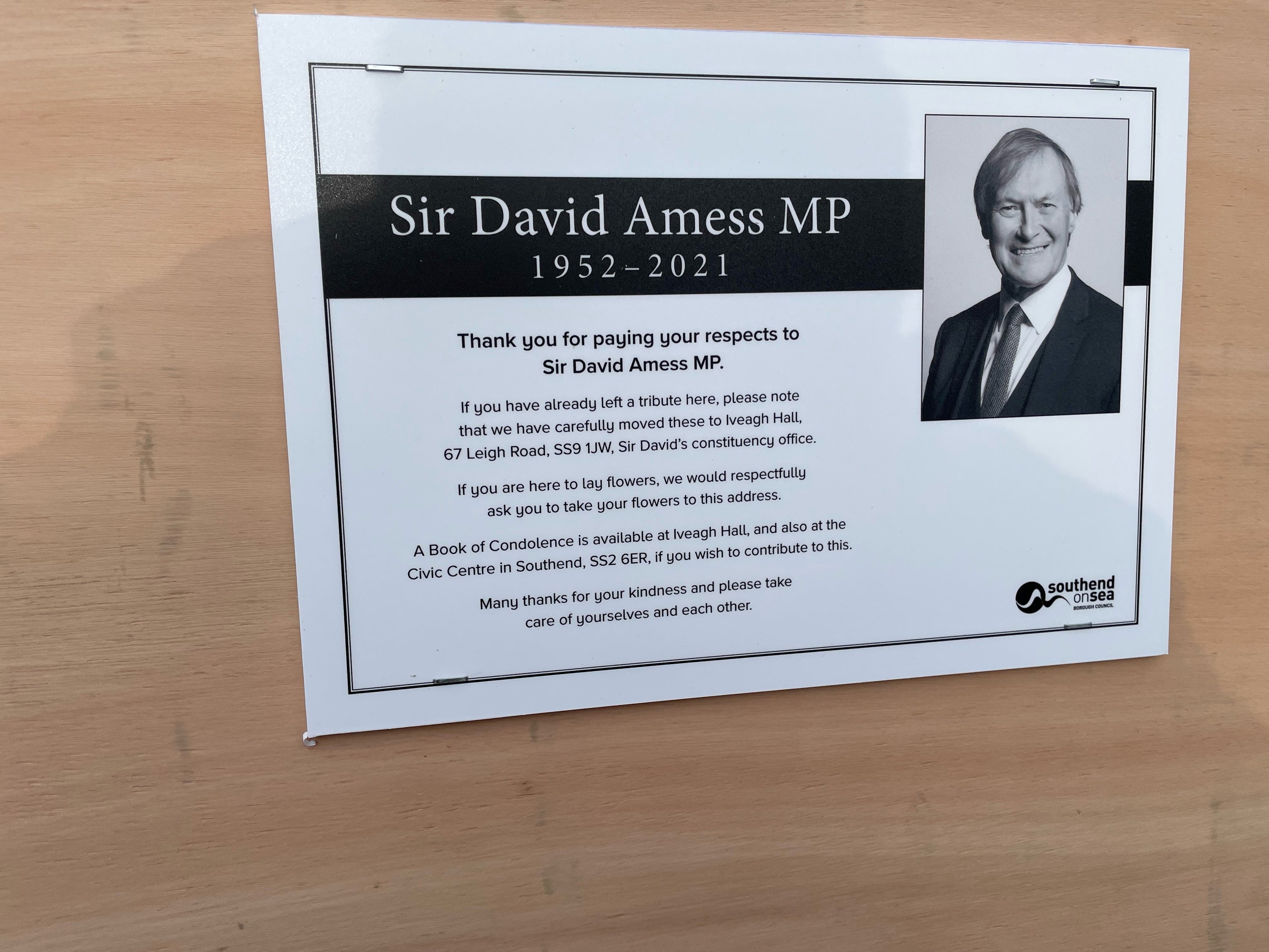 A sign placed next to the floral tributes left outside the Belfairs Methodist Church in Leigh-on-Sea, Essex, where Conservative MP Sir David Amess was killed (Sam Russell/PA)