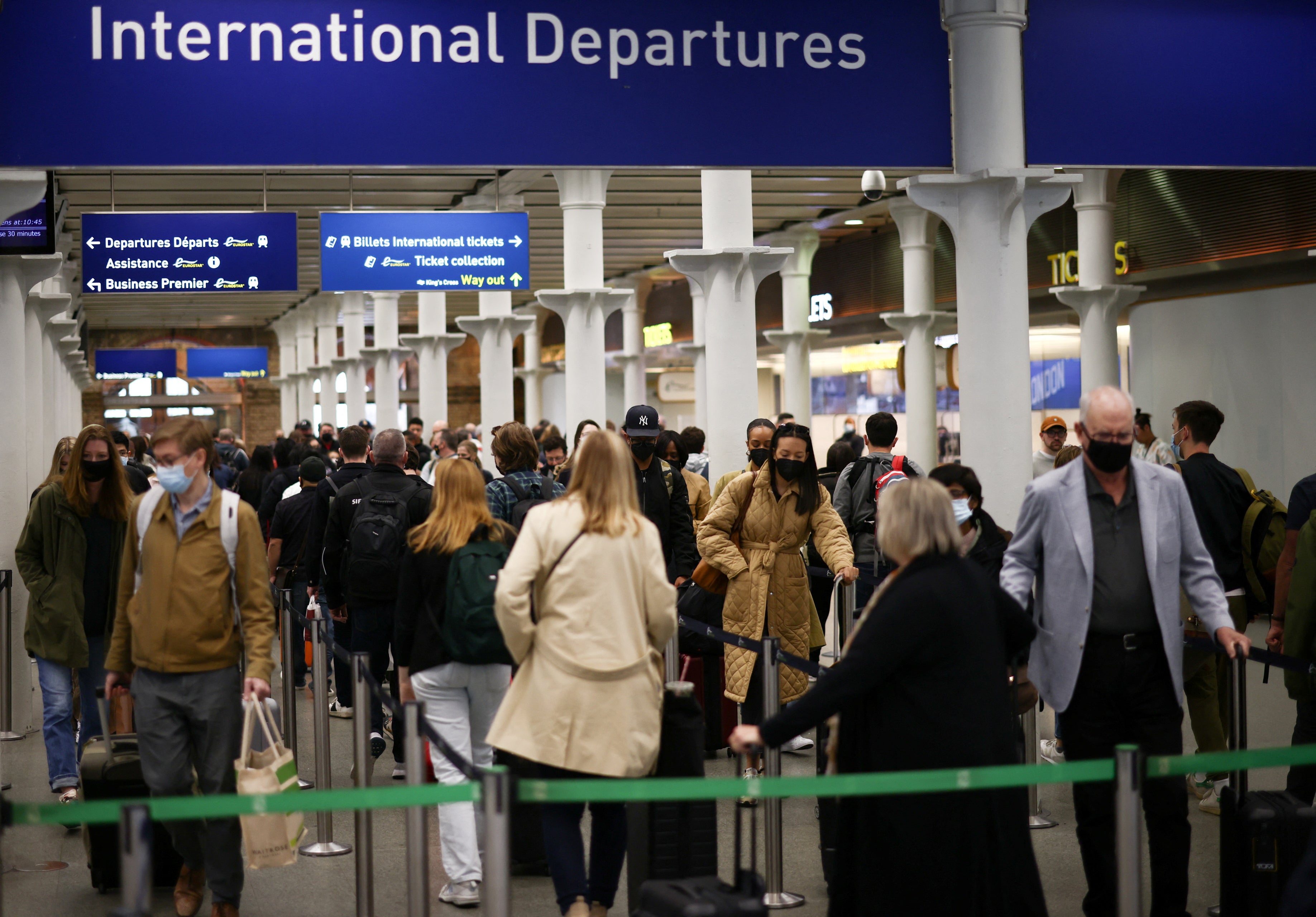 Passengers queue to check in for the Eurostar international rail service