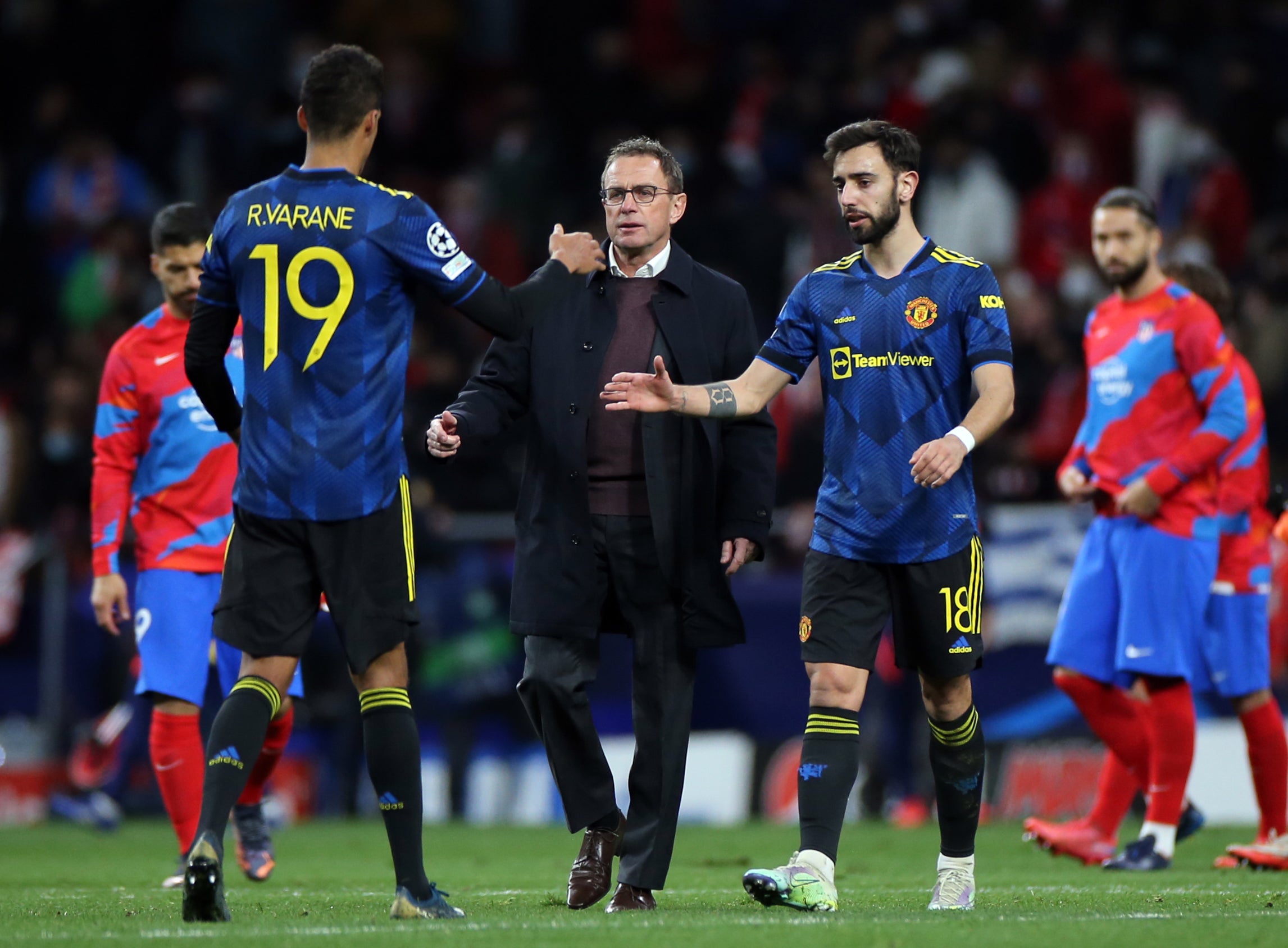 Ralf Rangnick, centre, can call on Bruno Fernandes, right, but Raphael Varane misses out (Isabel Infantes/PA)