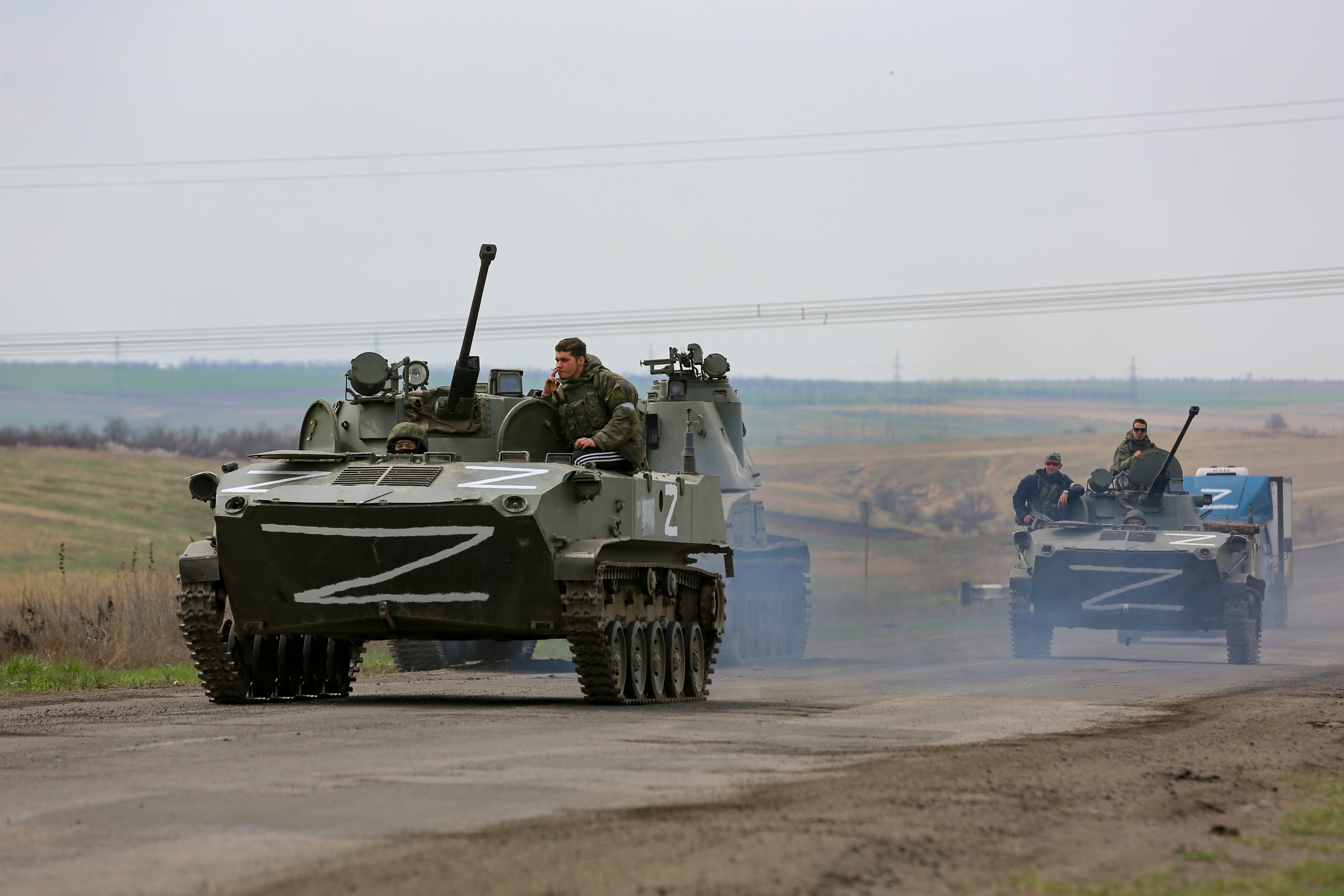 Russian military vehicles move on a highway in an area controlled by Russian-backed separatist forces near Mariupol, Ukraine,