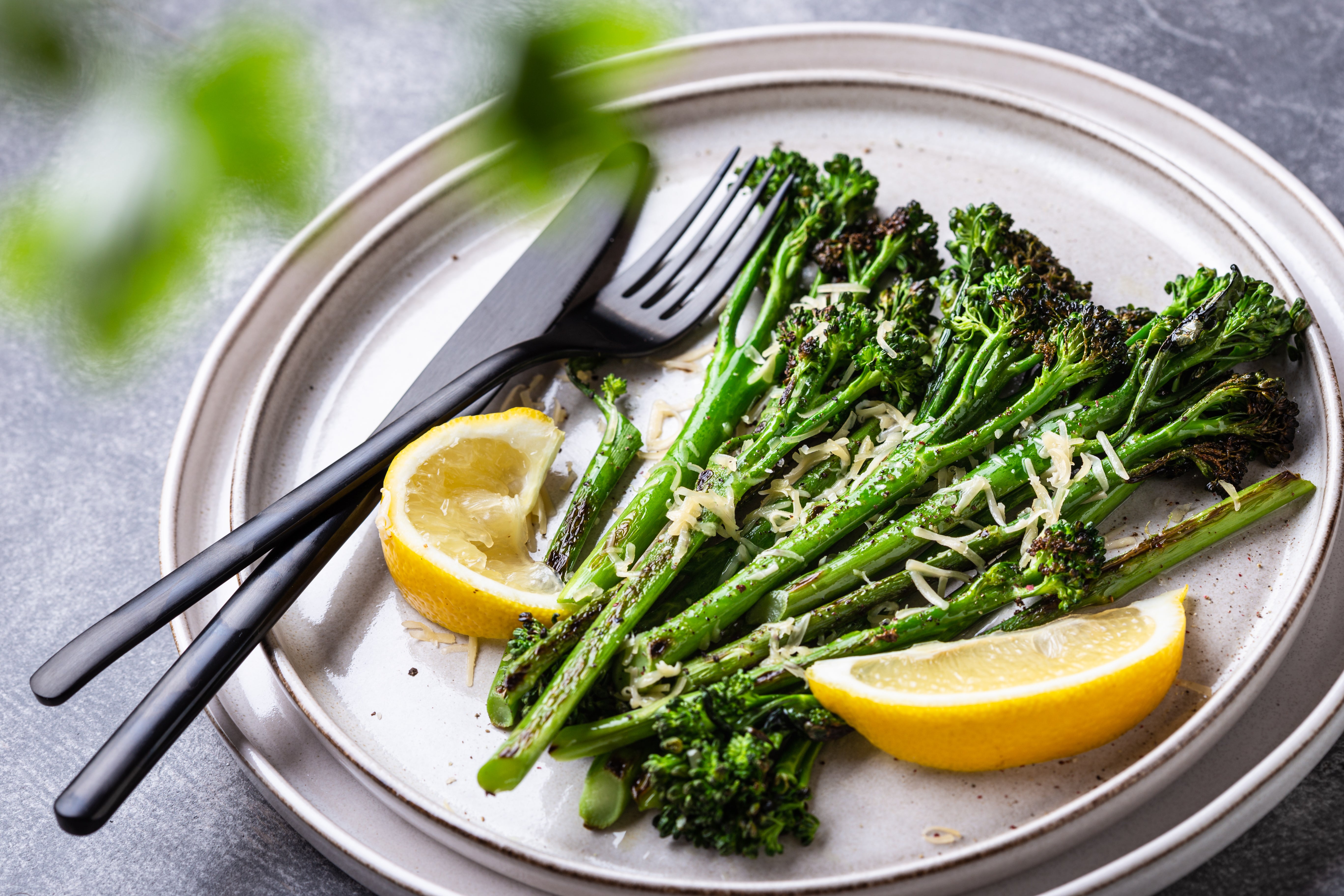 Asparagus and leeks are glossed with olive olive and covered in salty capers