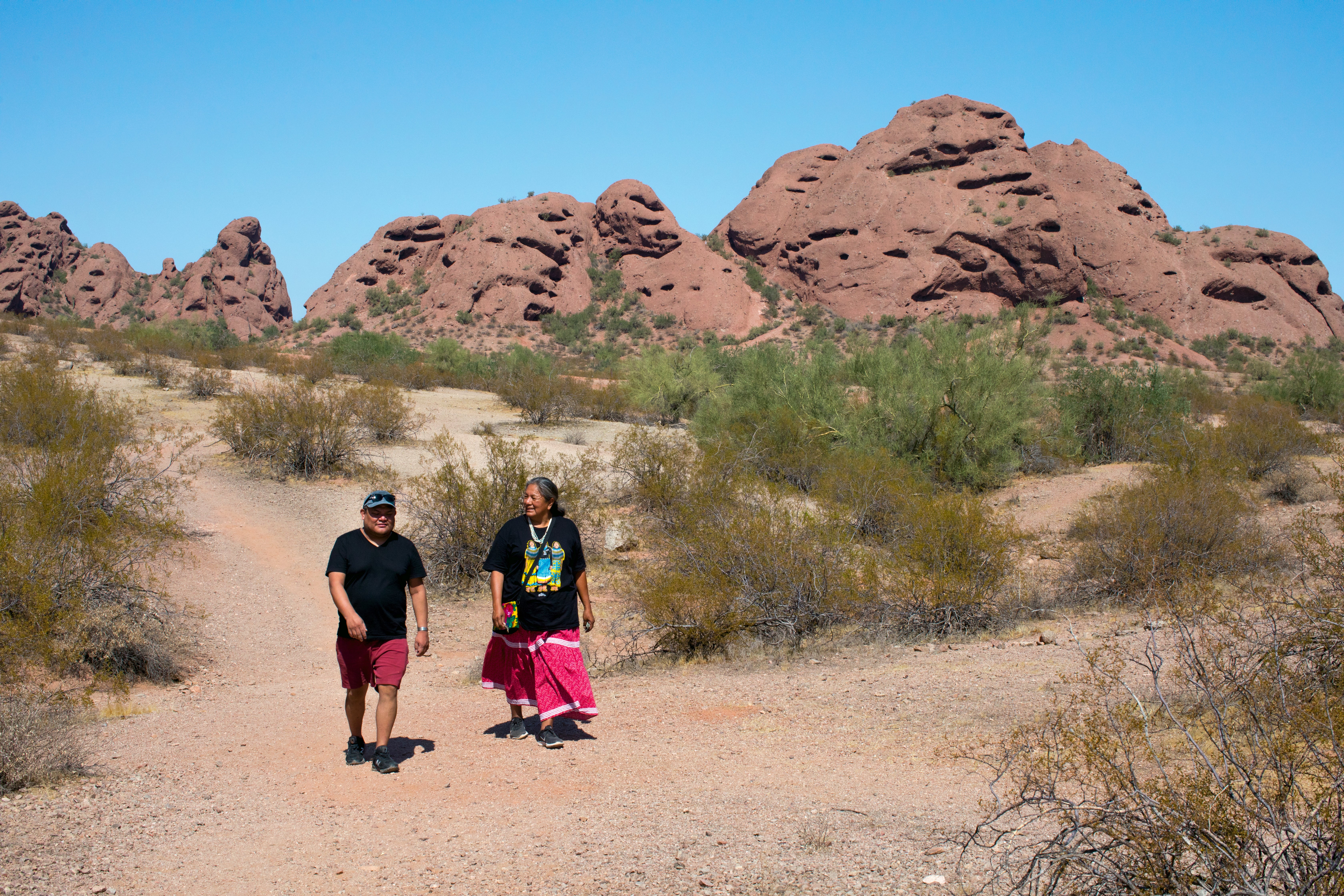 Bitsoie walking with food historian Twila Cassafore at Papago Park, Phoenix