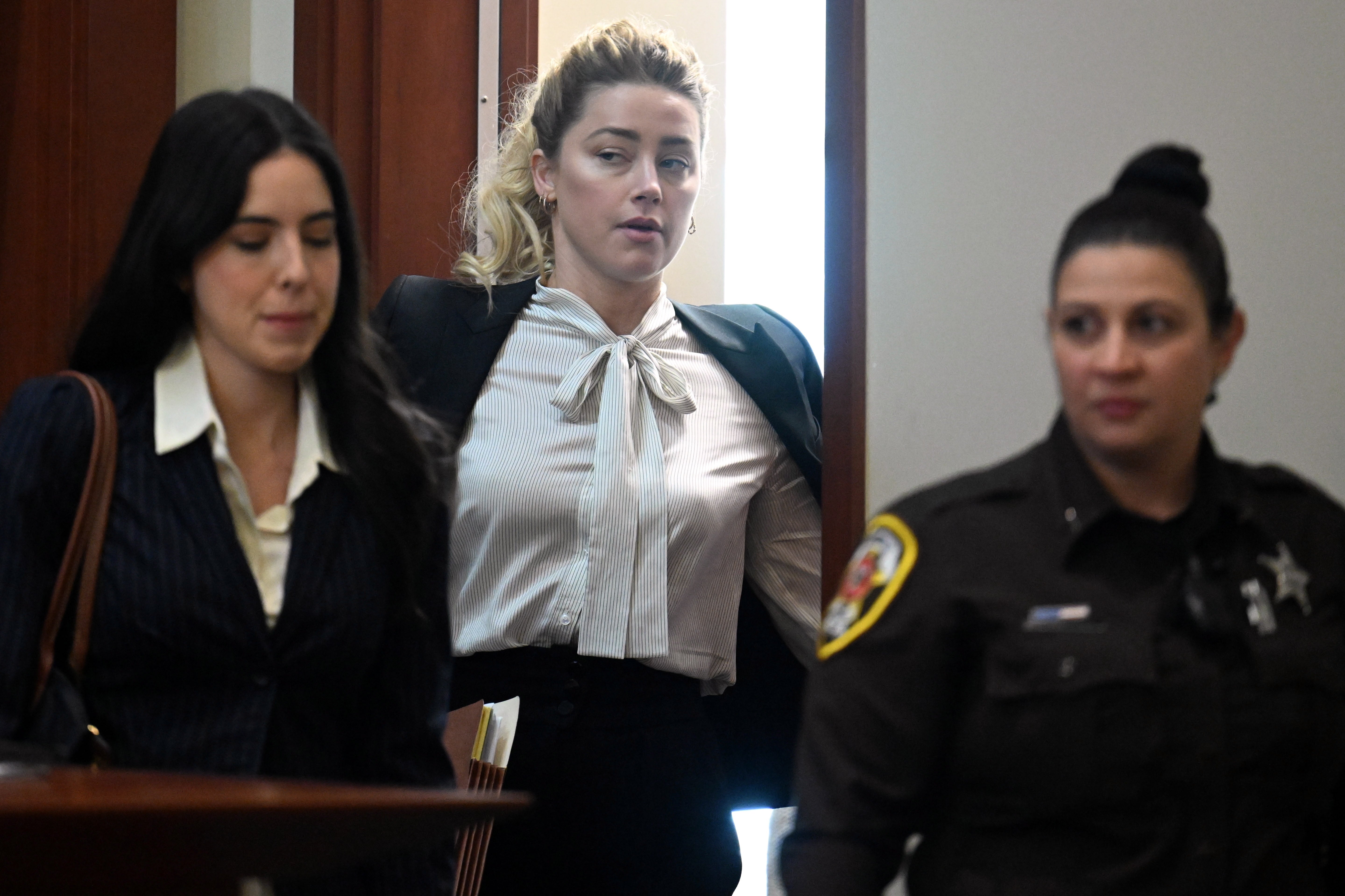 US actress Amber Heard looks on during a trial in the Fairfax County Circuit Courthouse in Fairfax, Virginia, USA, 19 April 2022