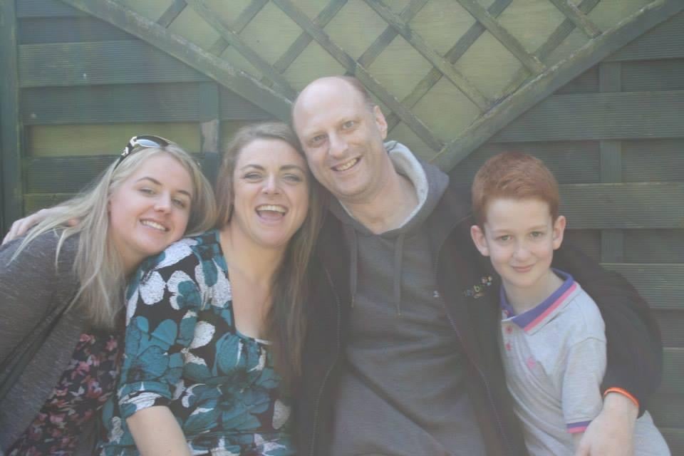 Abbi Smith, who was diagnosed with autism and learning difficulties early in her life, with her family