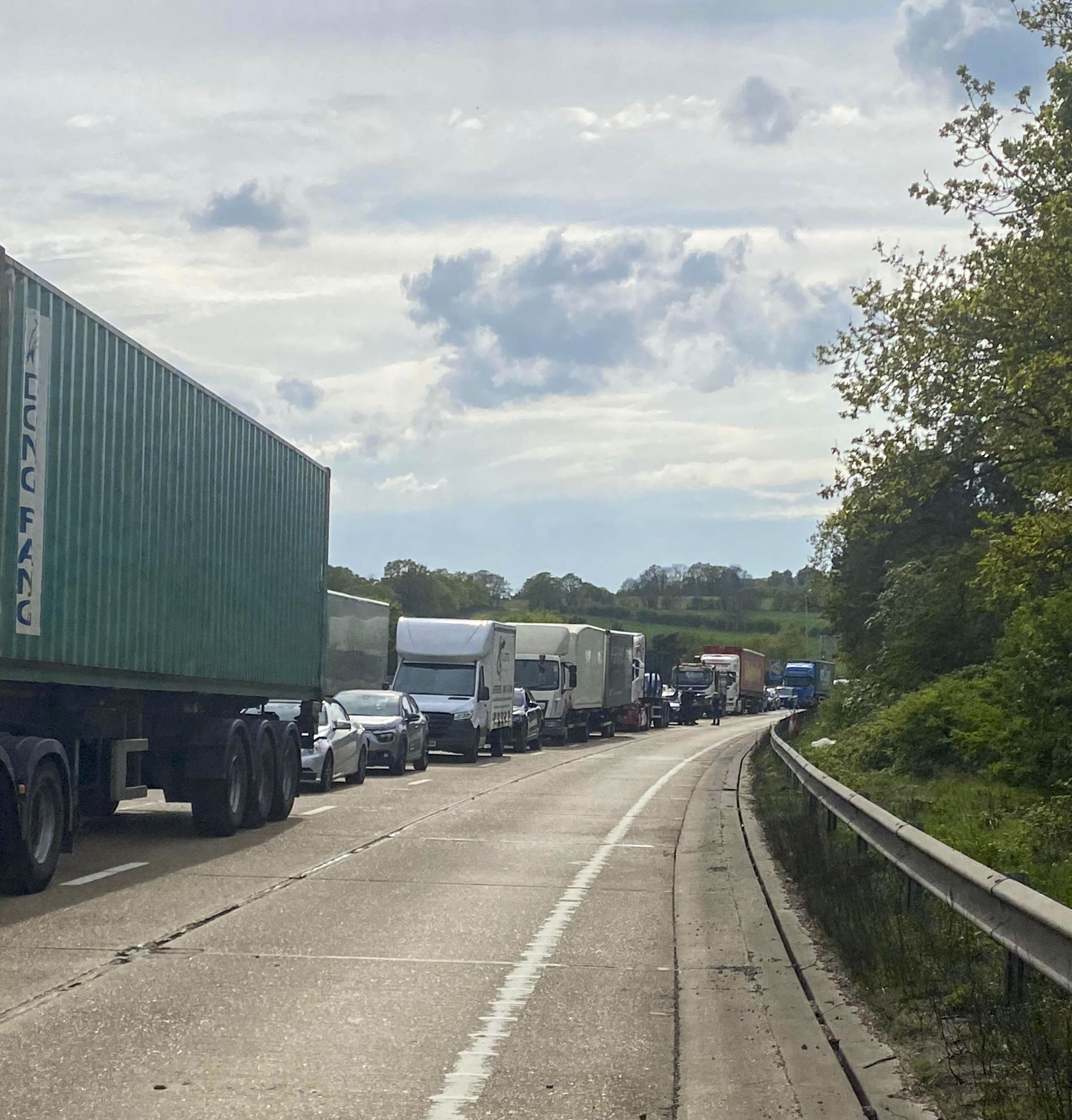 Handout photo courtesy of Dave Dewdney Photography of vehicles stuck on the M25 motorway after an accident where cooking oil has been spilt between junctions 24 and 25. Picture date: Tuesday April 19, 2022.