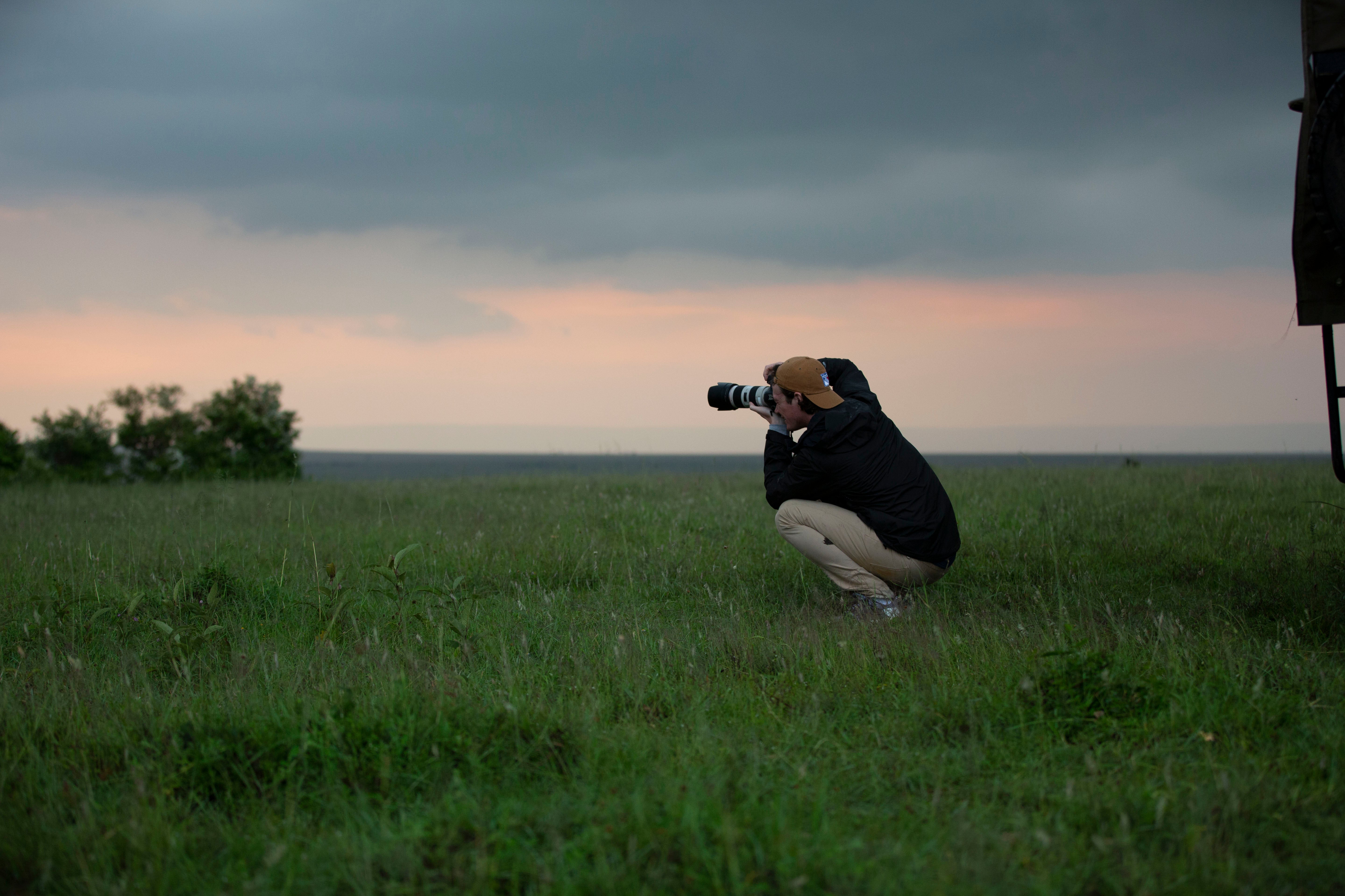 Setting up a shot during the rainy season [Maasai Mara, Kenya]