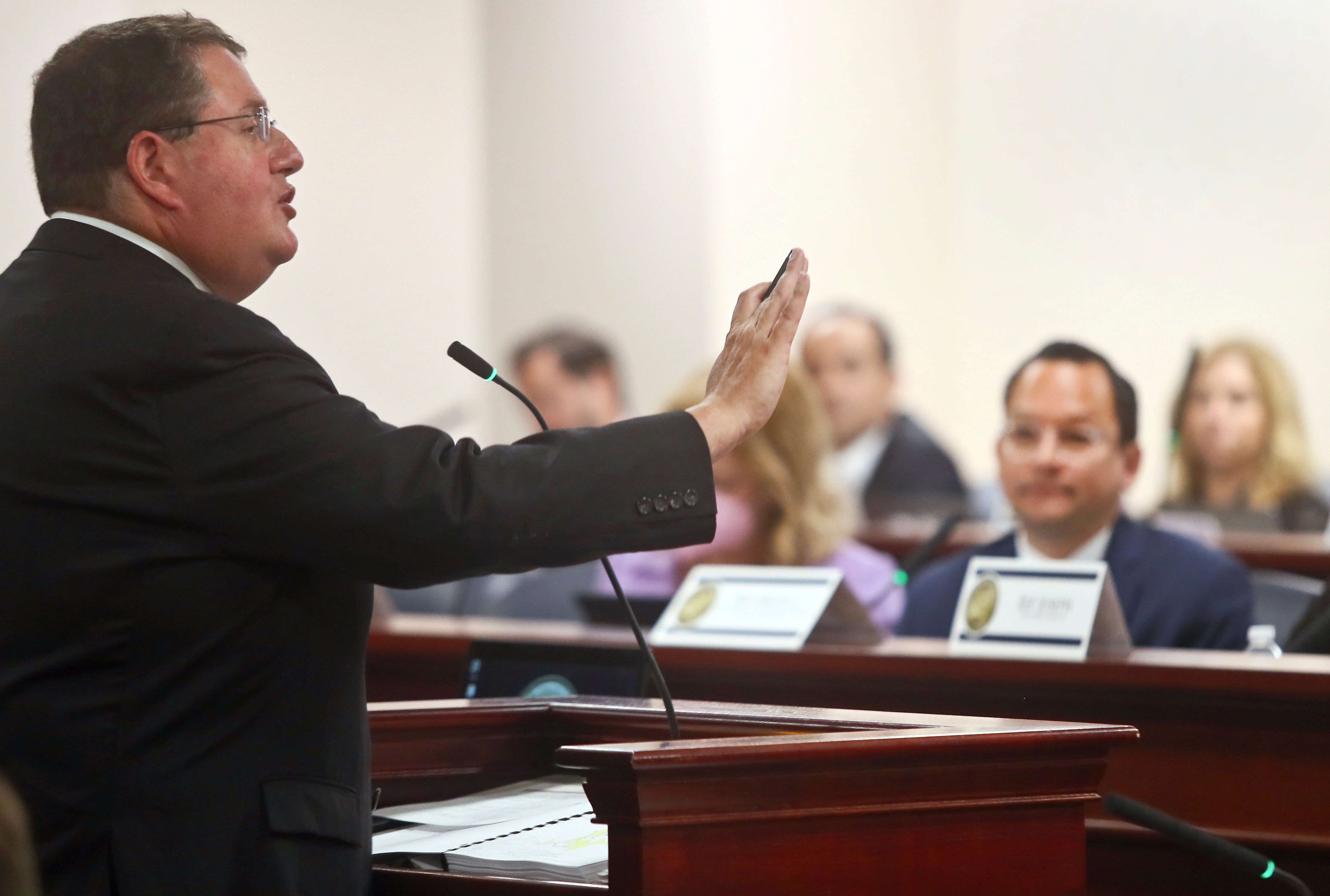 Florida Republican Randy Fine, left, introduced a measure that would dissolve Disney World’s self-governing arrangement.