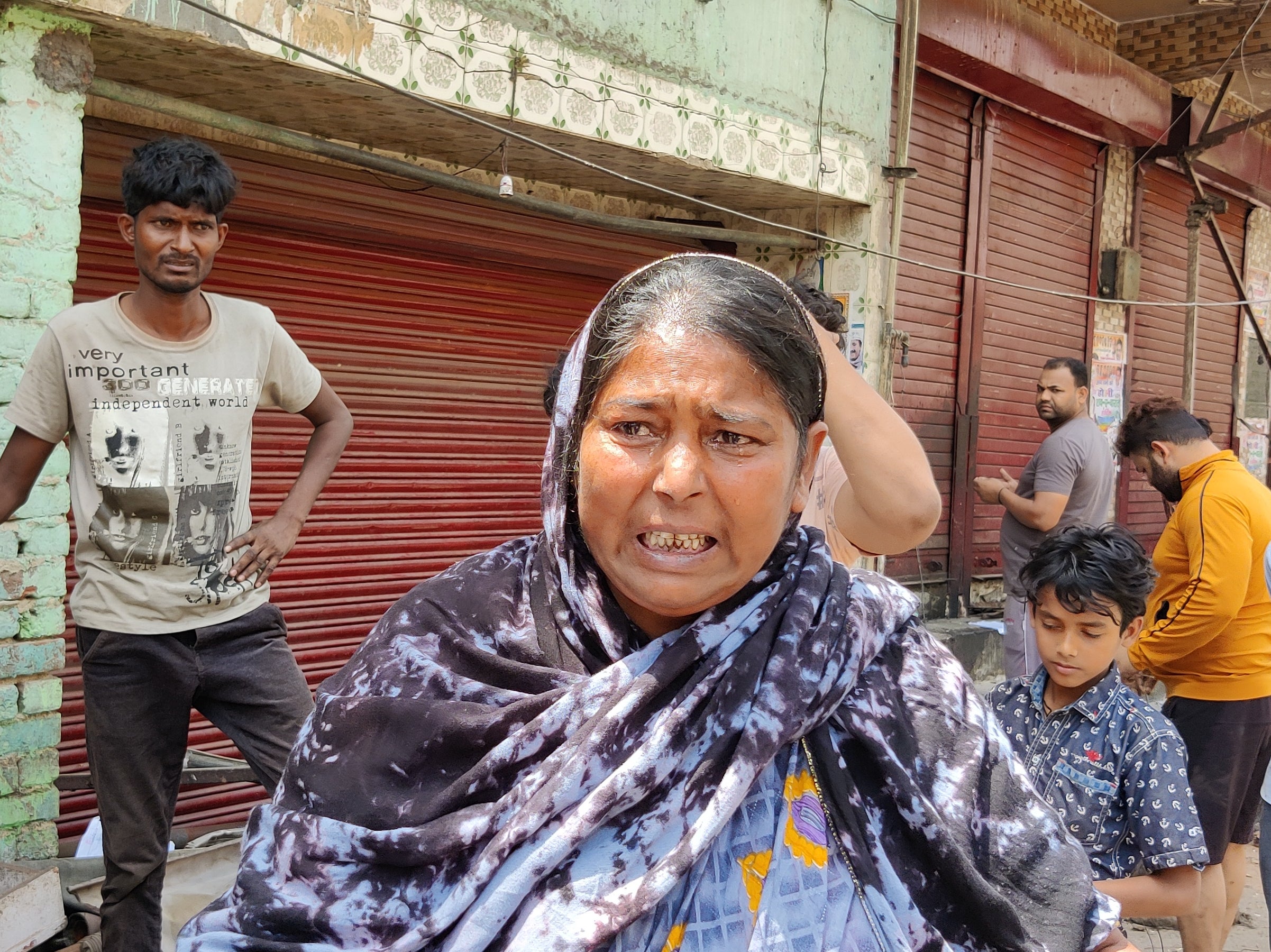 Radhida Bewa cries after authorities demolished her food cart