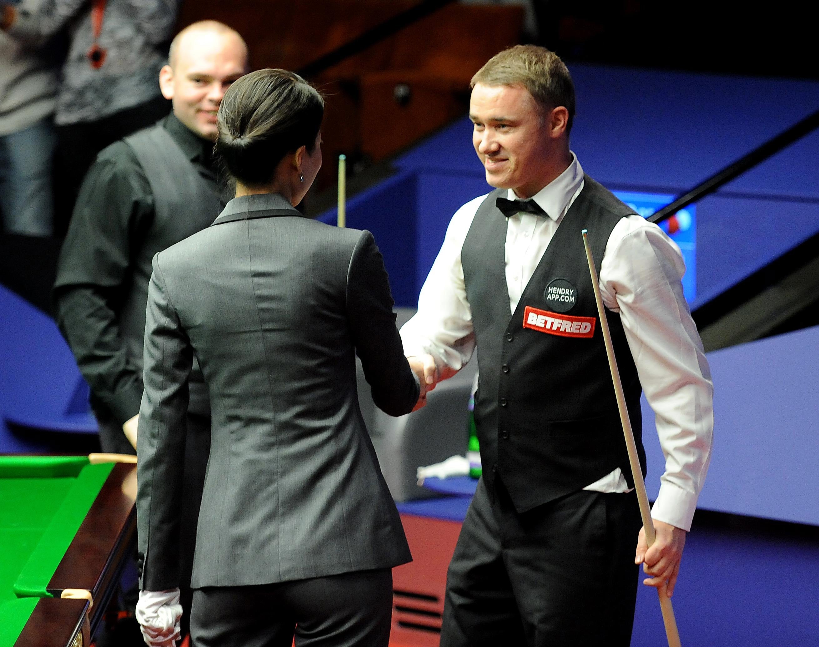 Stephen Hendry, right, is congratulated by match referee Zhu Ying after his 147 against Stuart Bingham in 2012 (Anna Gowthorpe/PA)