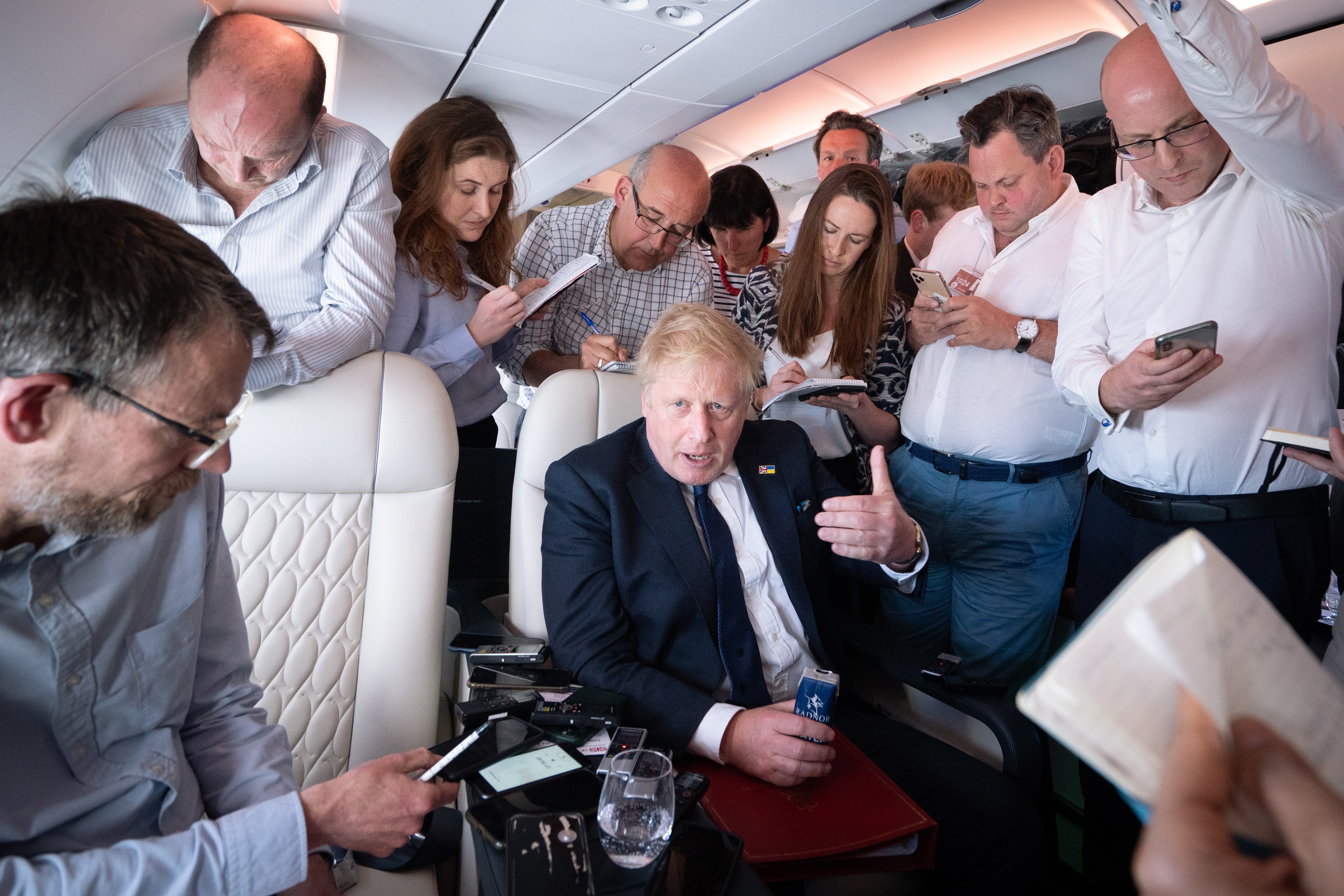 UK prime minister, Boris Johnson, speaks to the media on his flight to India