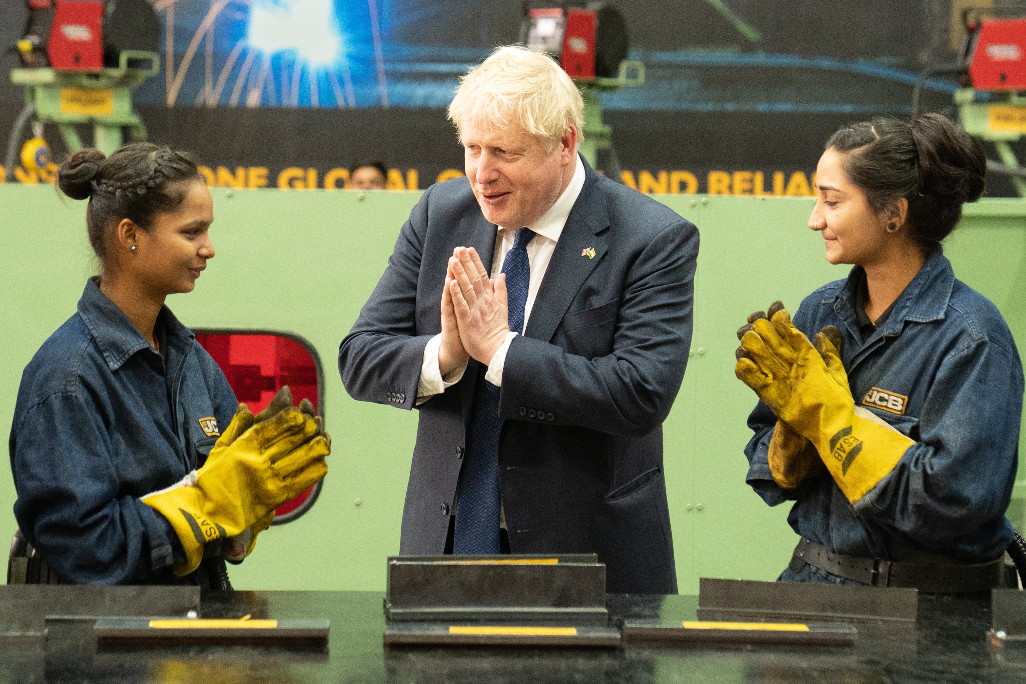 Prime Minister Boris Johnson speaks to workers at the new JCB factory in Vadodara, Gujarat (Stefan Rousseau/PA)