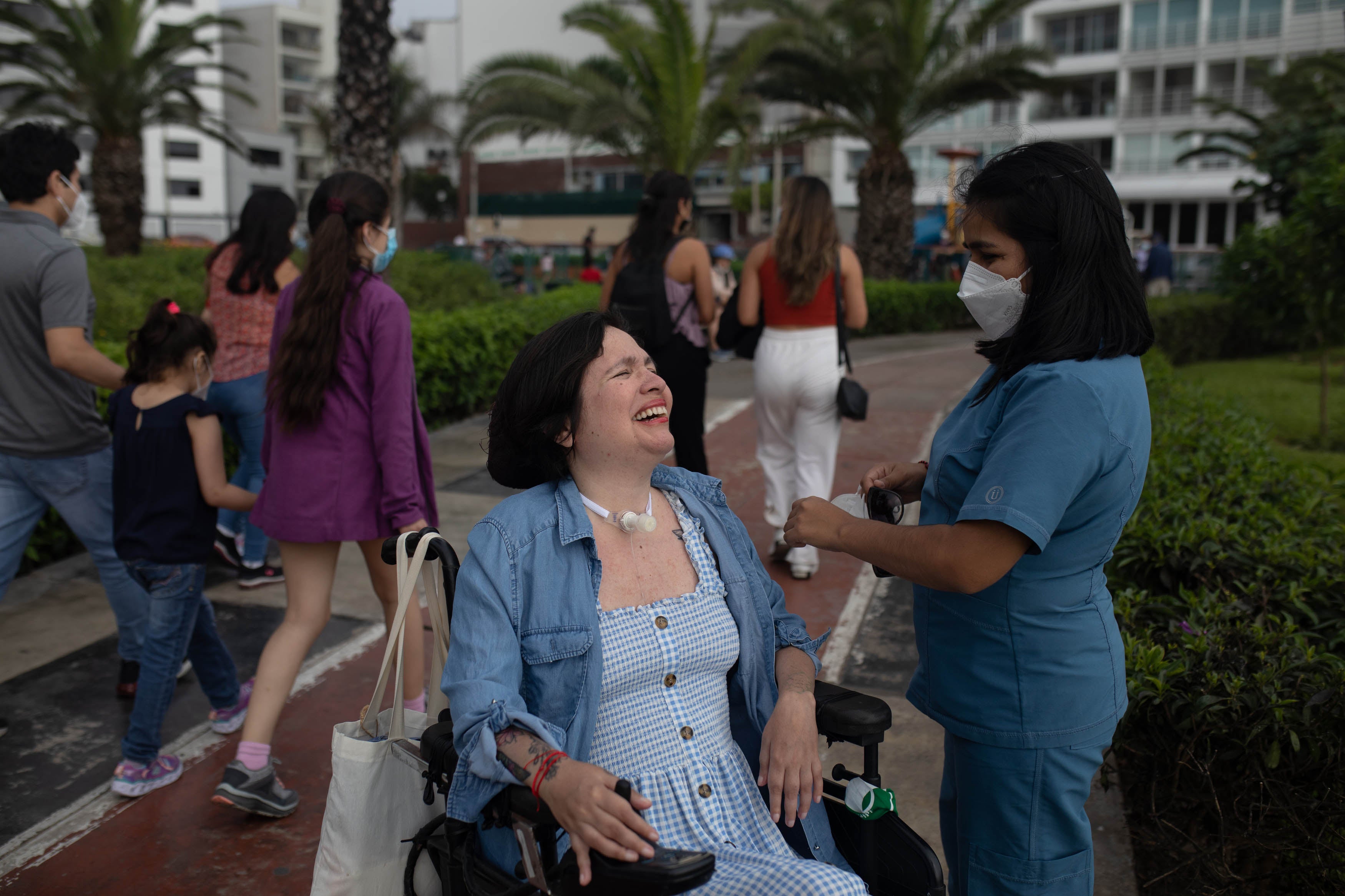 Estrada talks with a nurse while out on their walk