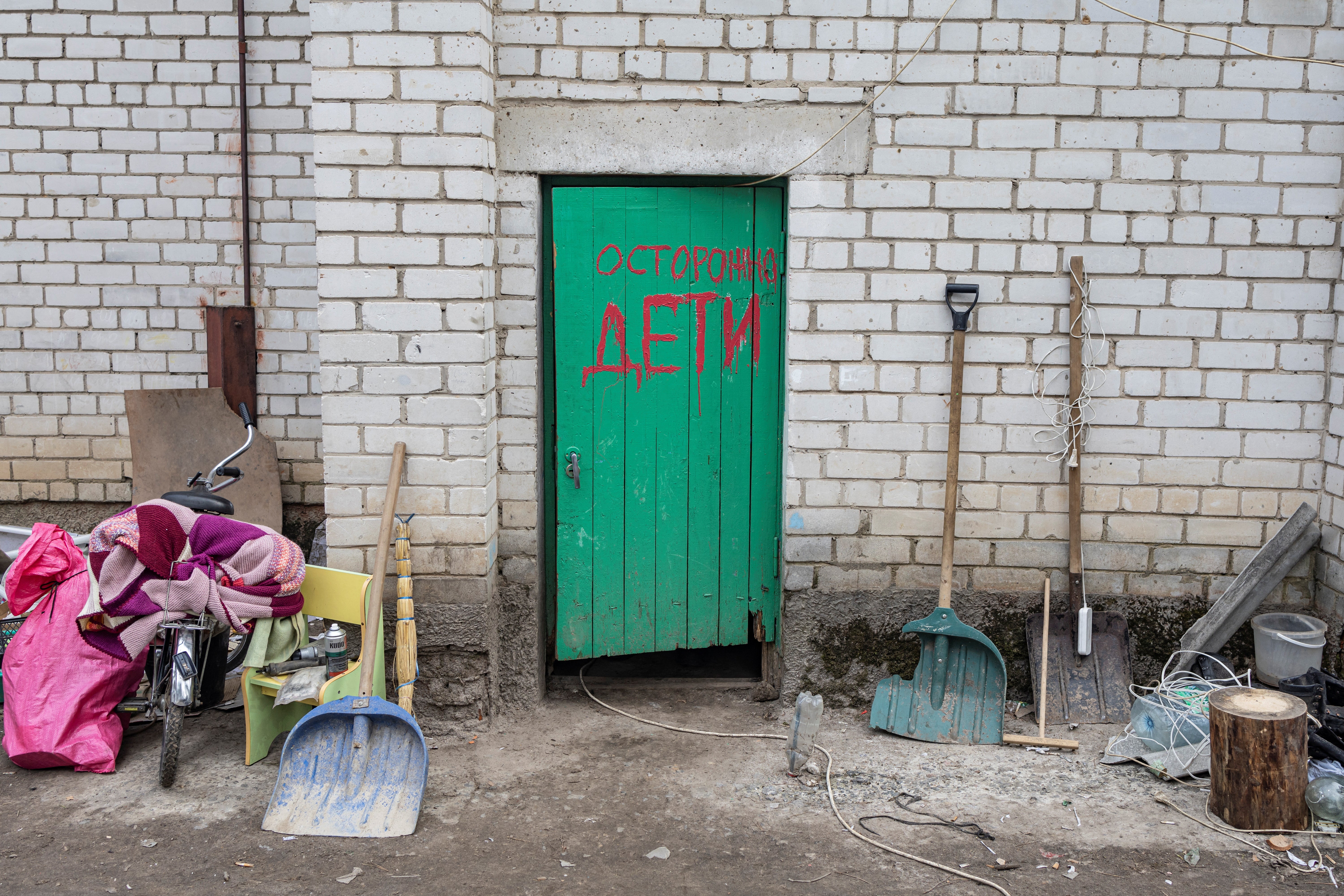 The entrance to the basement of the school is inscribed with the words ‘Be careful, children’