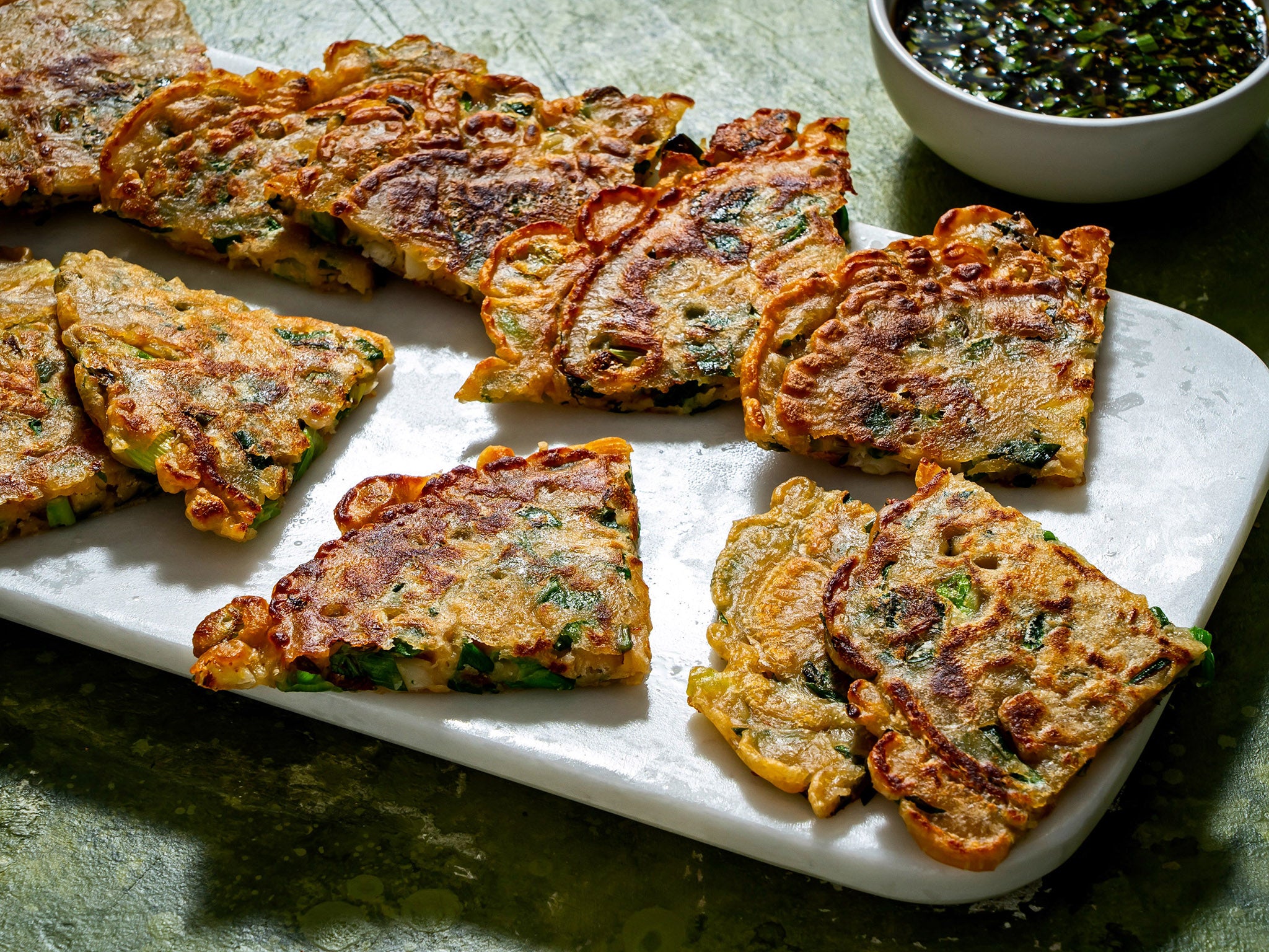 Swapping spring onions for leeks turns these pancakes crunchy on the outside, creamy on the inside