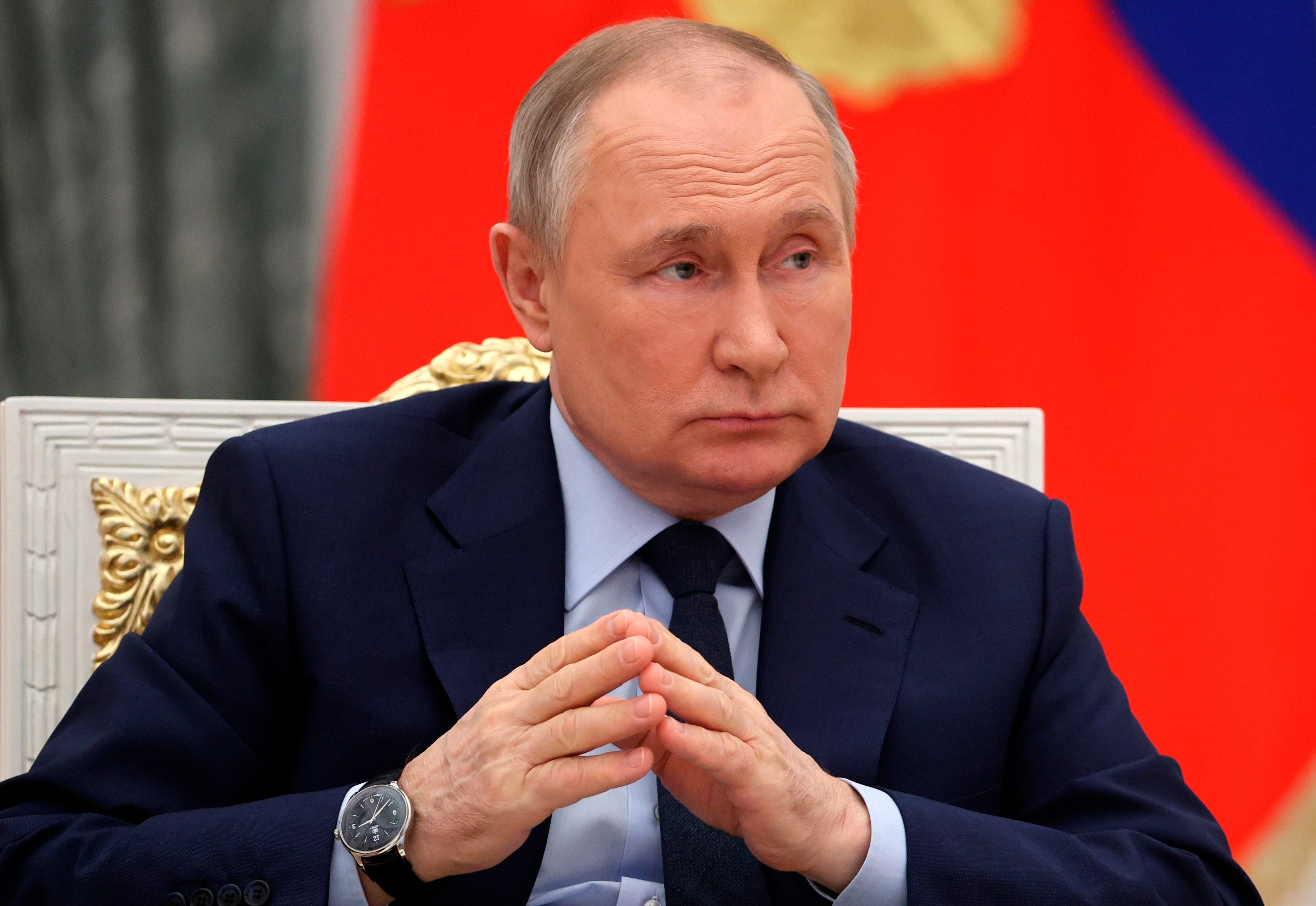 Russian President Vladimir Putin listens during a meeting of the Russia the Land of Opportunity Supervisory Board at the Kremlin, in Moscow, Russia, Wednesday, April 20, 2022. (Mikhail Tereshchenko, Sputnik, Kremlin Pool Photo via AP)