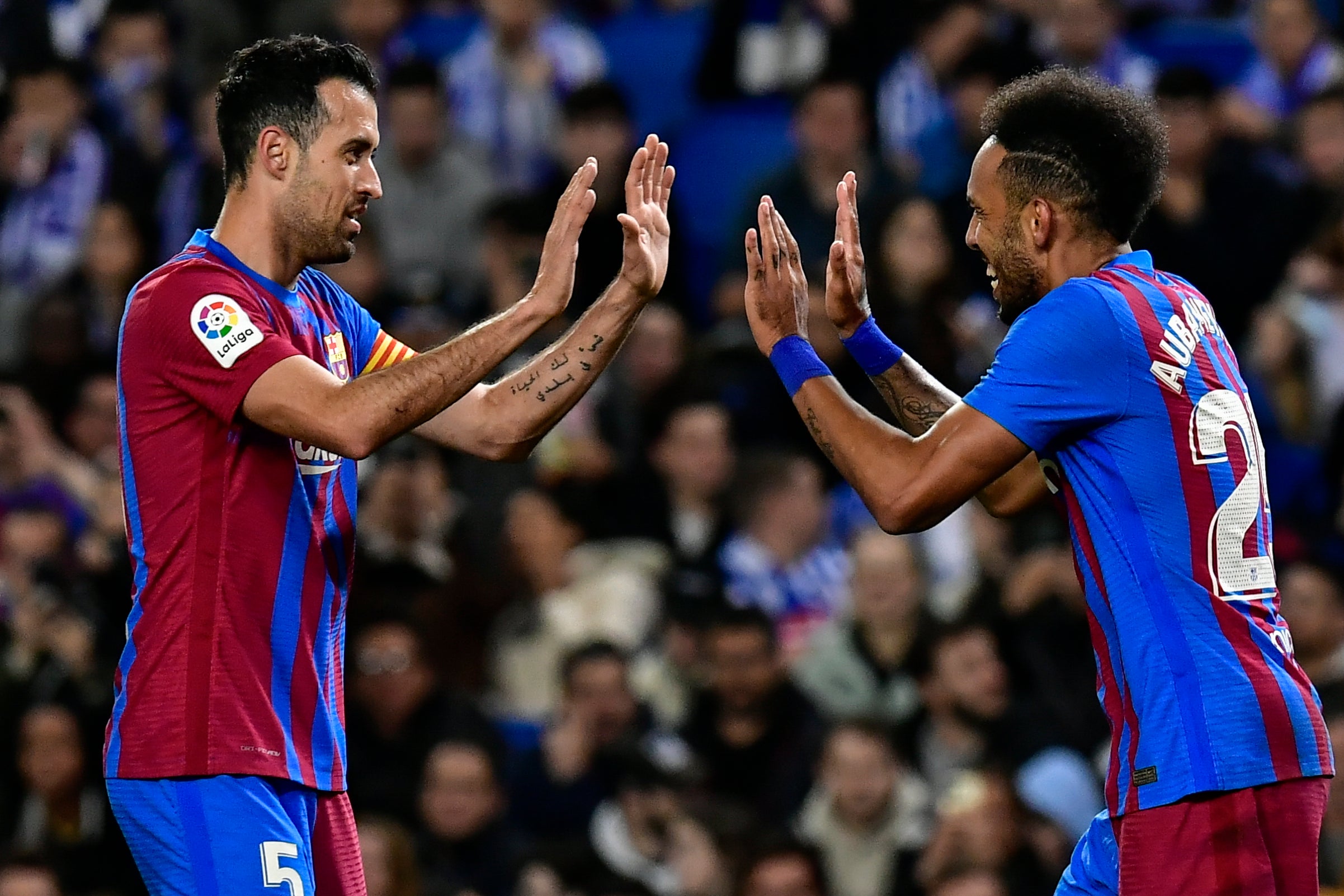 Barcelona’s Pierre-Emerick Aubameyang (right0 celebrates his winner at Real Sociedad with Sergio Busquets (Alvaro Barrientos/AP/PA)