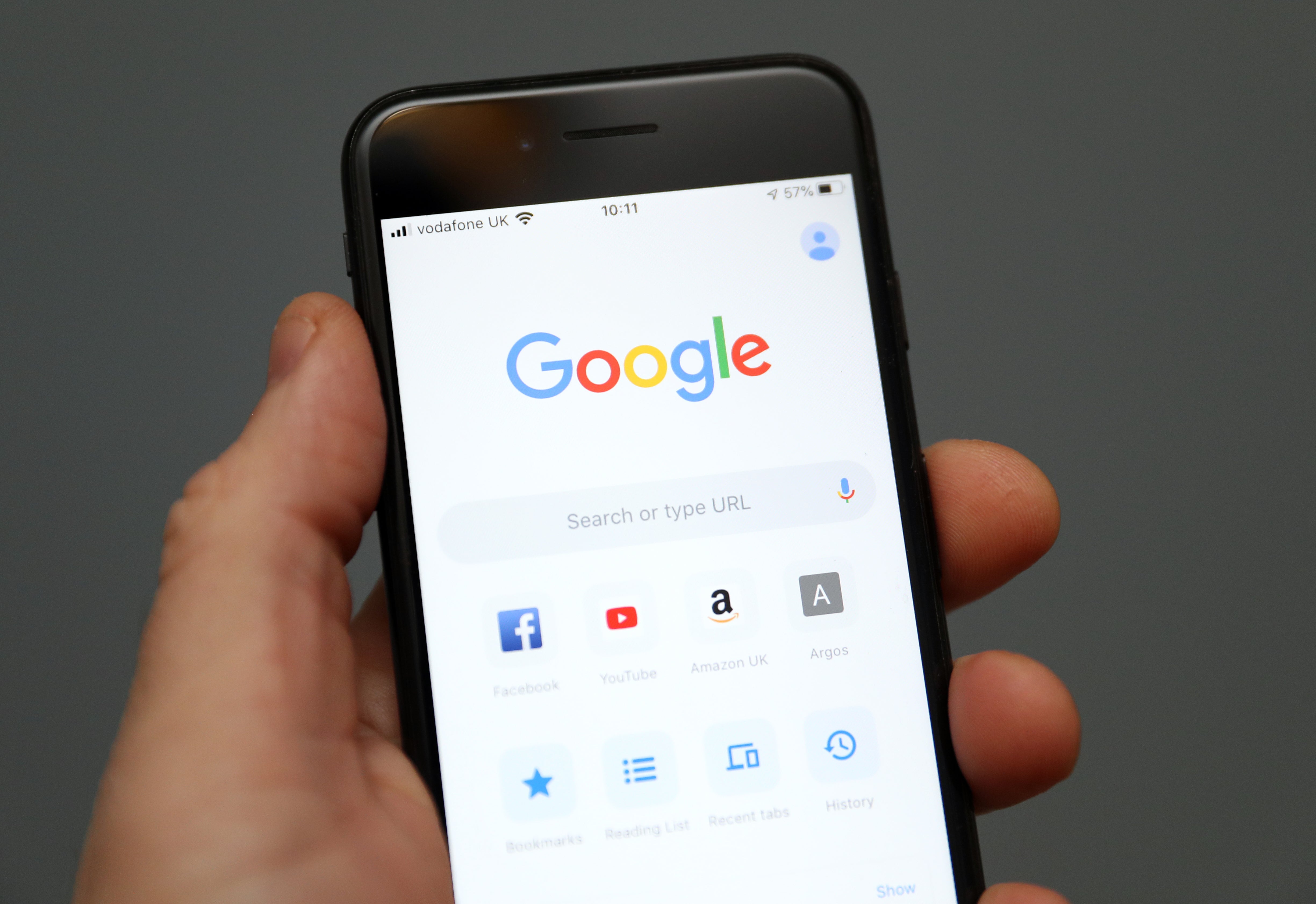 A person holds an iPhone showing the app for Google chrome search engine. Picture date: Friday January 3, 2020 (Andrew Matthews/PA)