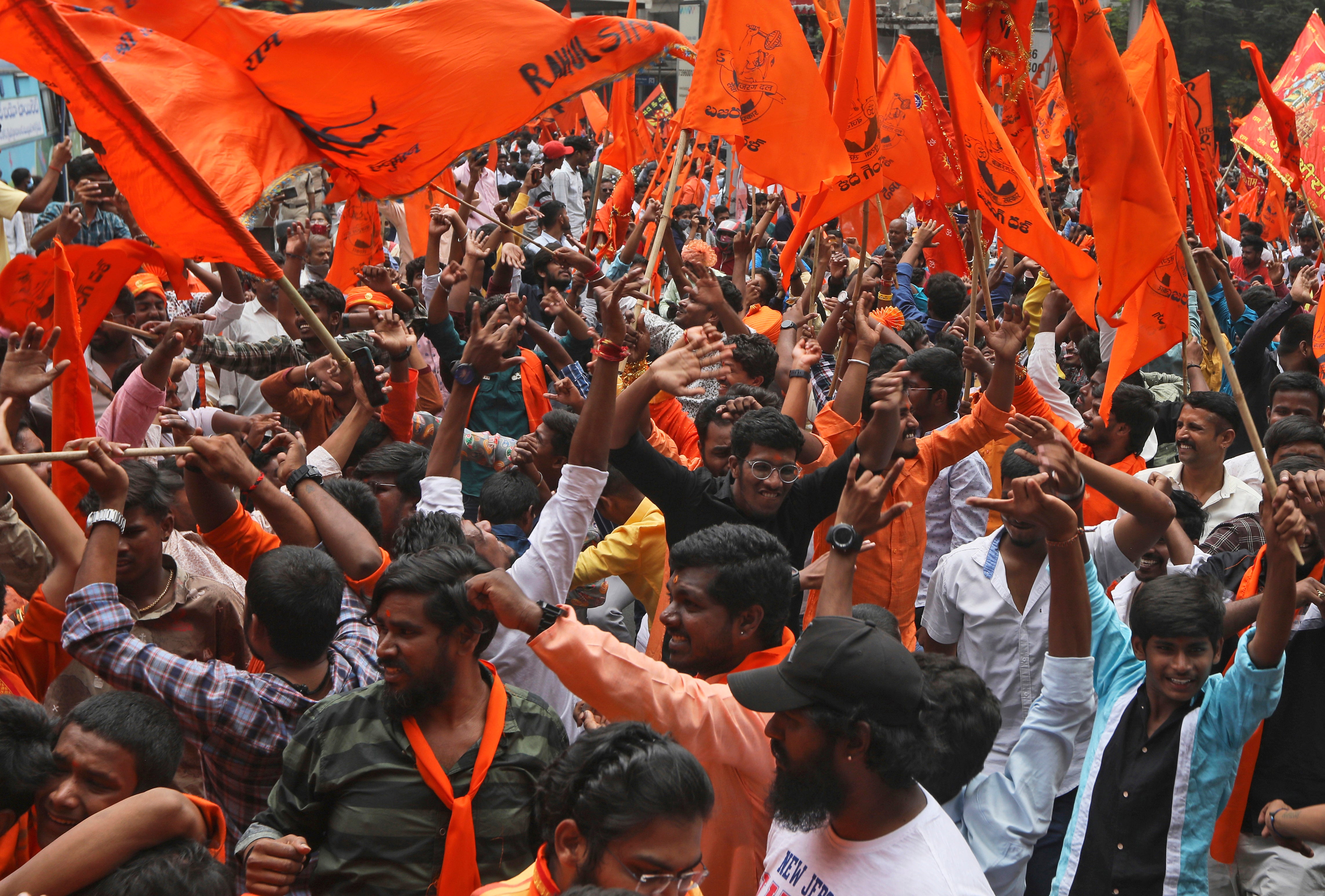 Hindus participate in a religious procession to mark a festival in Hyderabad on 16 April 2022. India’s hardline Hindu nationalists have long espoused an anti-Muslim stance, but attacks against the minority community have recently occurred more frequently. In many cases, hate-filled and provocative songs that are blared through speakers during Hindu festivals have become a precursor to this violence