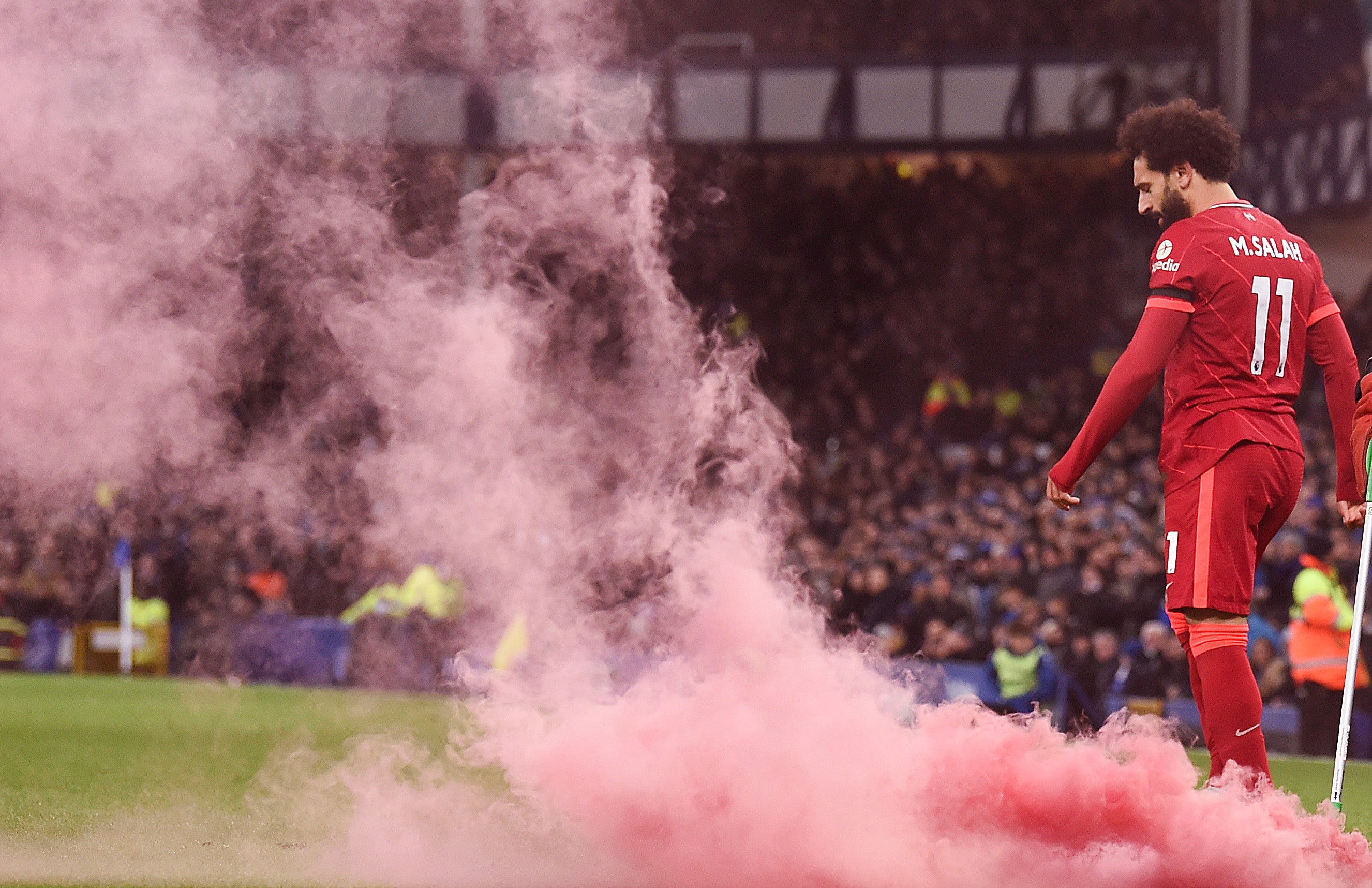 Mohamed Salah’s second goal in December’s Merseyside derby is greted by a red smoke bomb