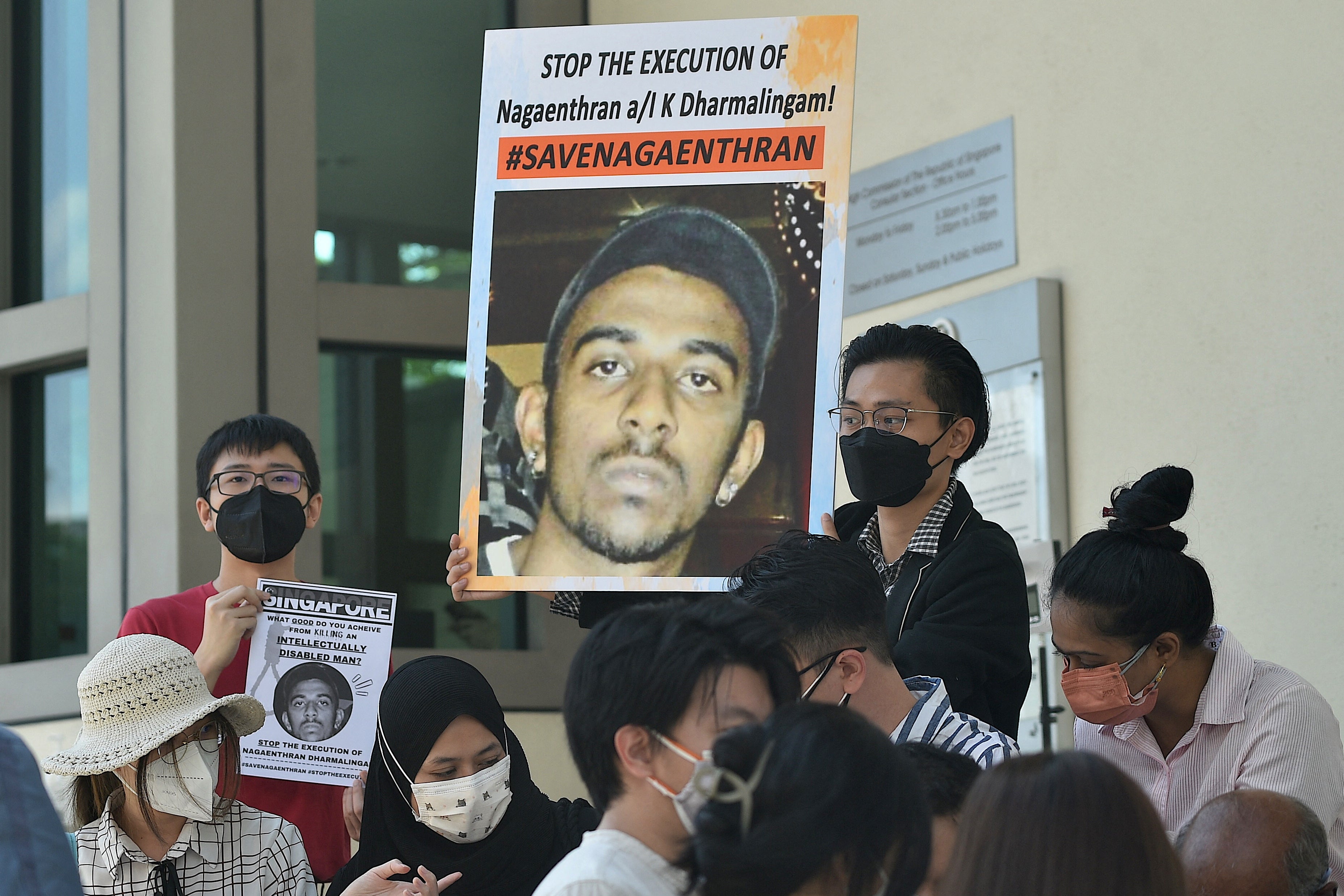 Activists hold posters against the execution of Nagaenthran Dharmalingam outside the Singapore High Commision in Kuala Lumpur on 9 March