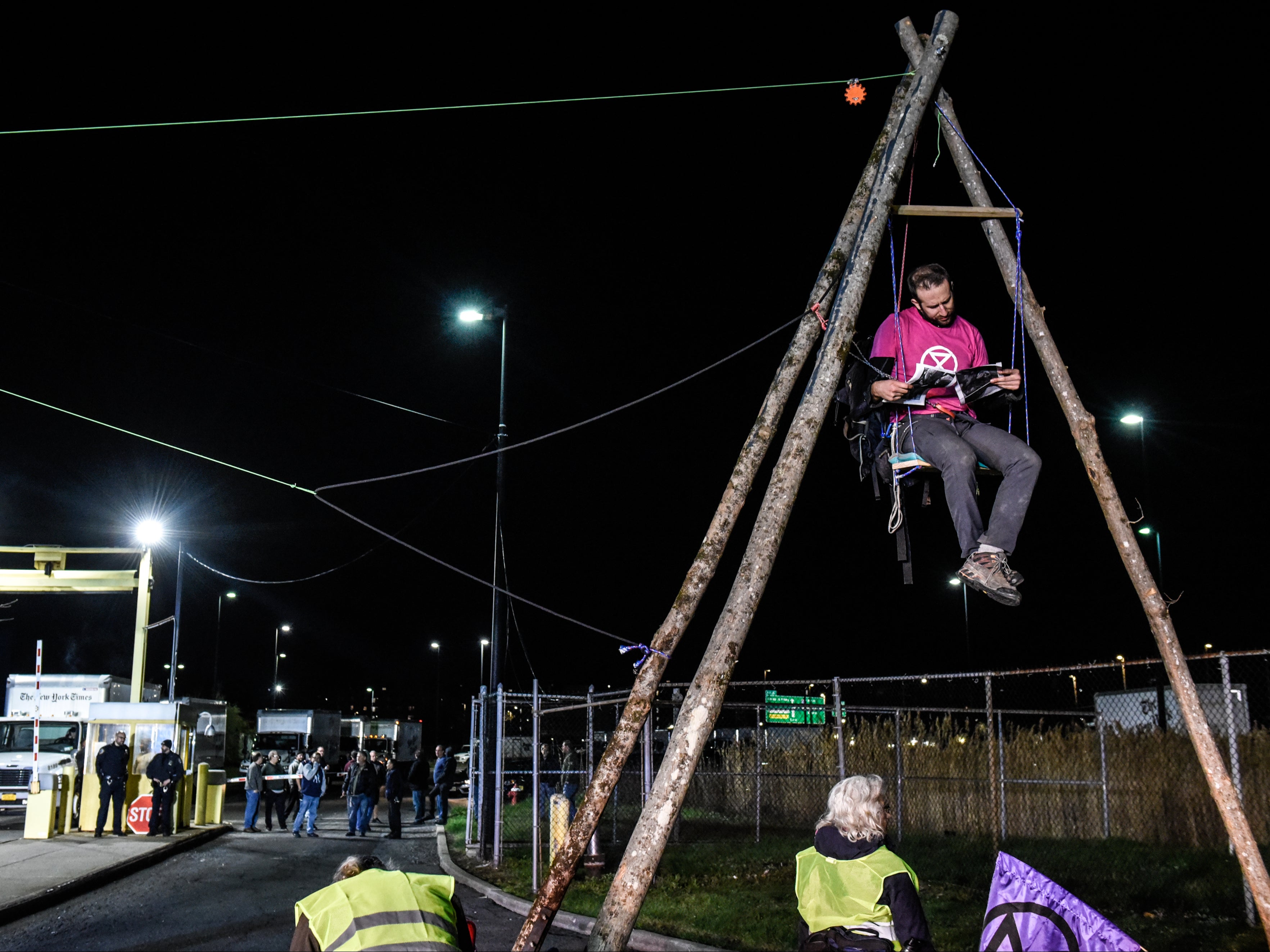 Environmental activist group Extinction Rebellion sets up a blockade in front of the New York Times printing plant