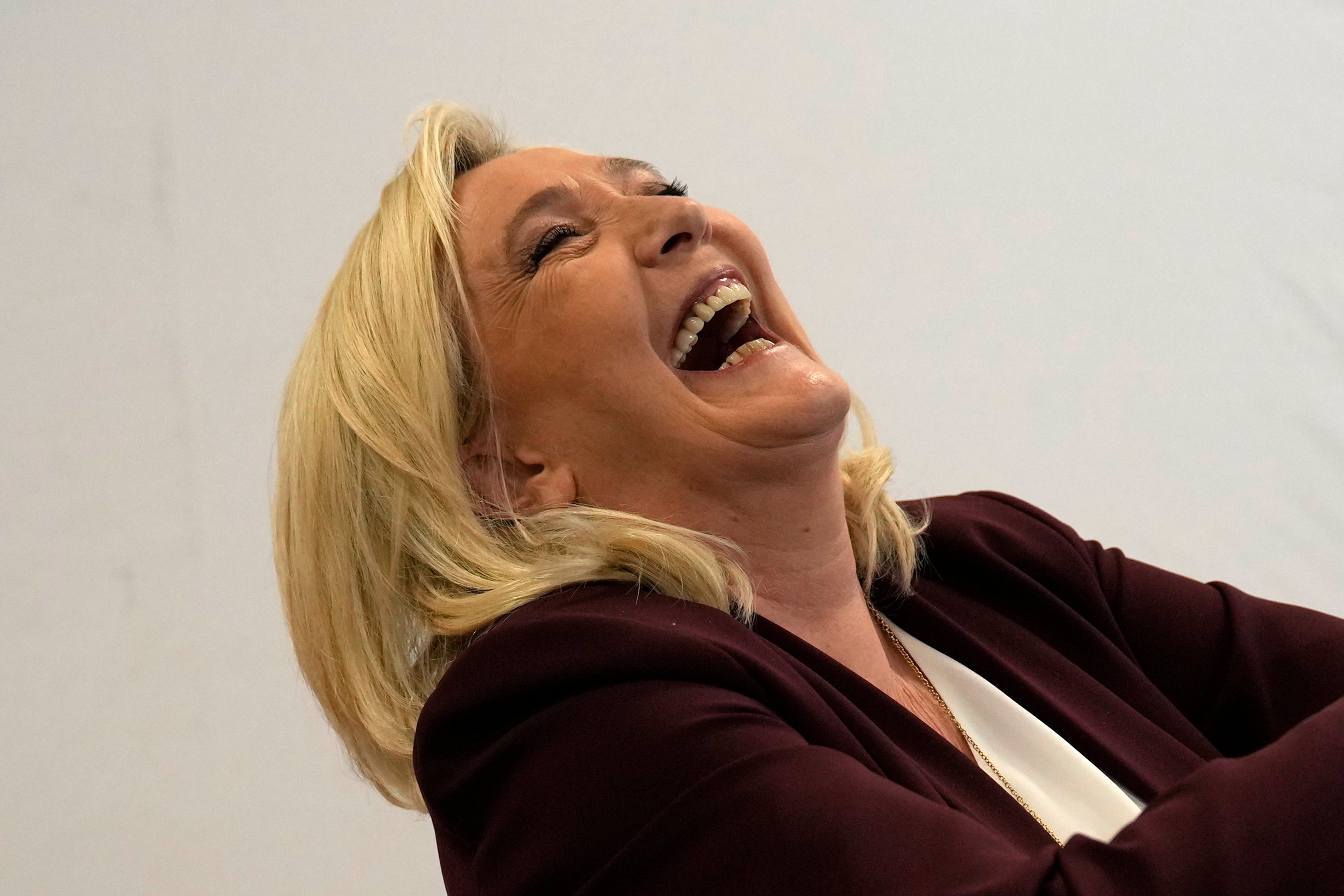 Marine Le Pen laughs during a press conference in Vernon, west of Paris, on 12 April