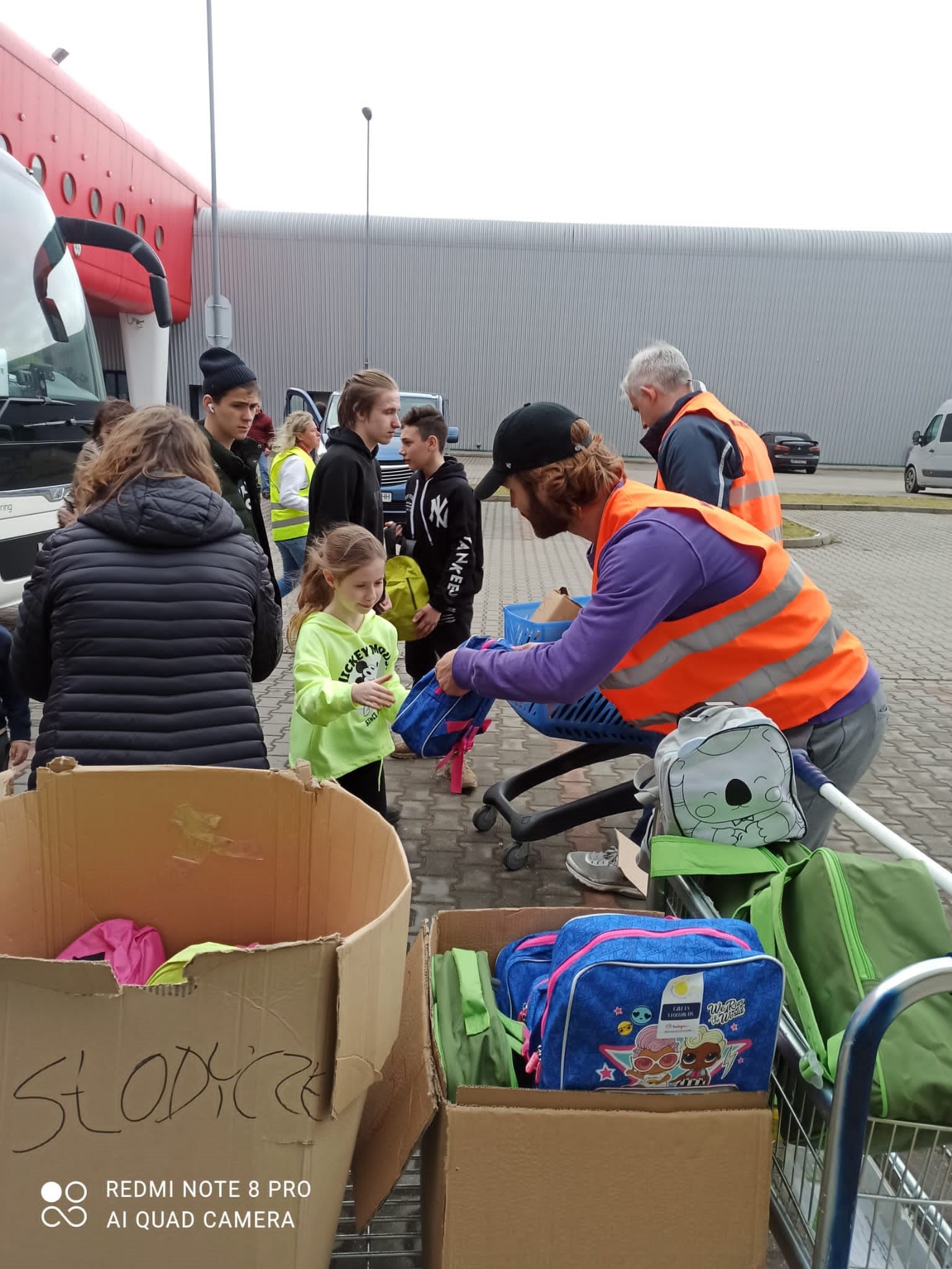 Neil Spalding handing out backpacks in Warsaw (Stuart Thomas/PA)