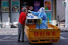 Shanghai to install door alarms to stop people with Covid leaving homes as restrictions ramp up