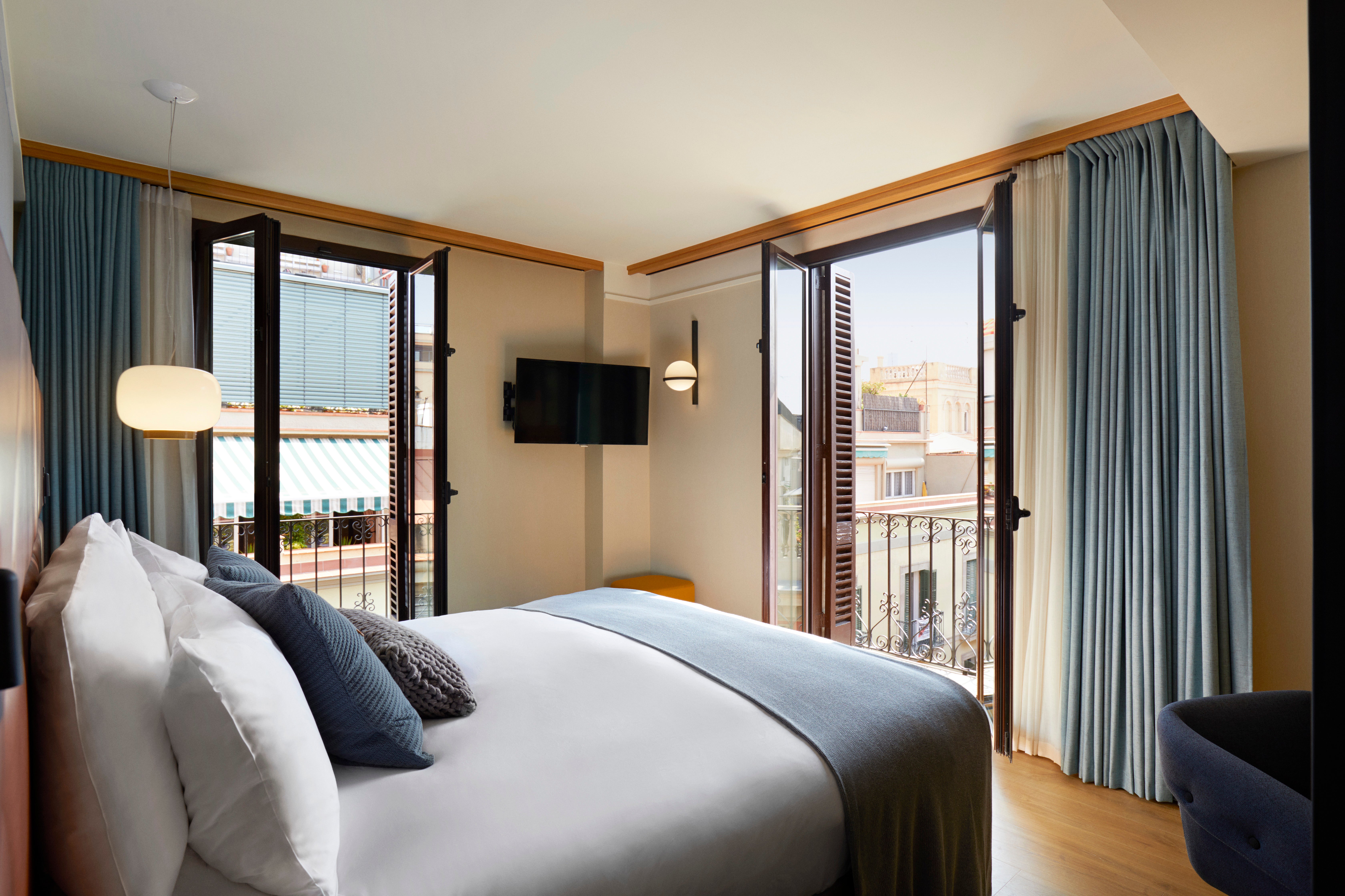 Enjoy the sights and sounds of the Ciutat Vella neighbourhood from the comfort of your spacious room