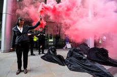 Extinction Rebellion activists light flares and ambush energy secretary on Earth Day