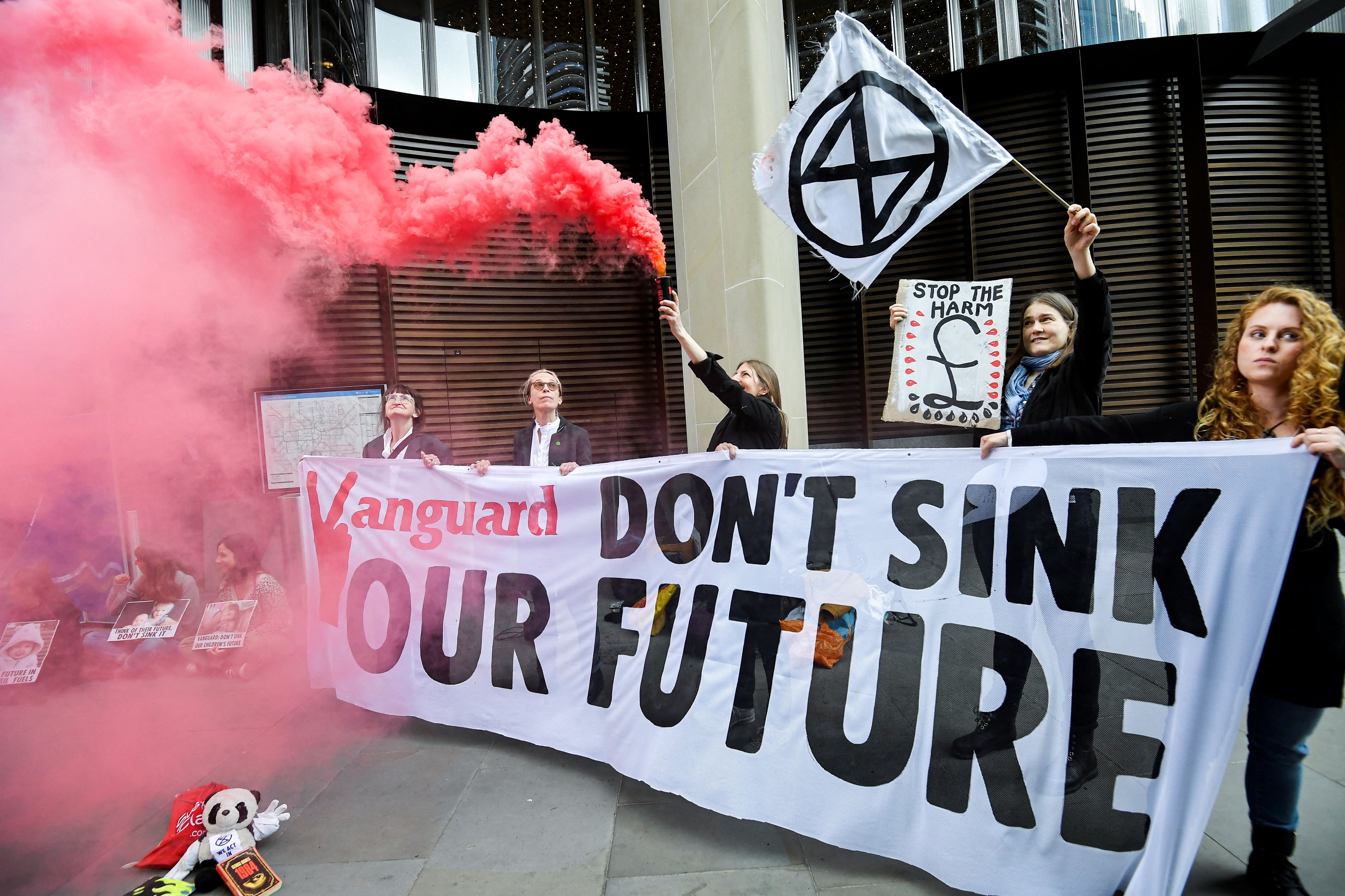 Protesters hold a sign reading ‘Vanguard don’t sink our future'