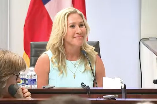 Marjorie Taylor Greene testifies under oath at a hearing to determine if she can be on the ballot in 2022