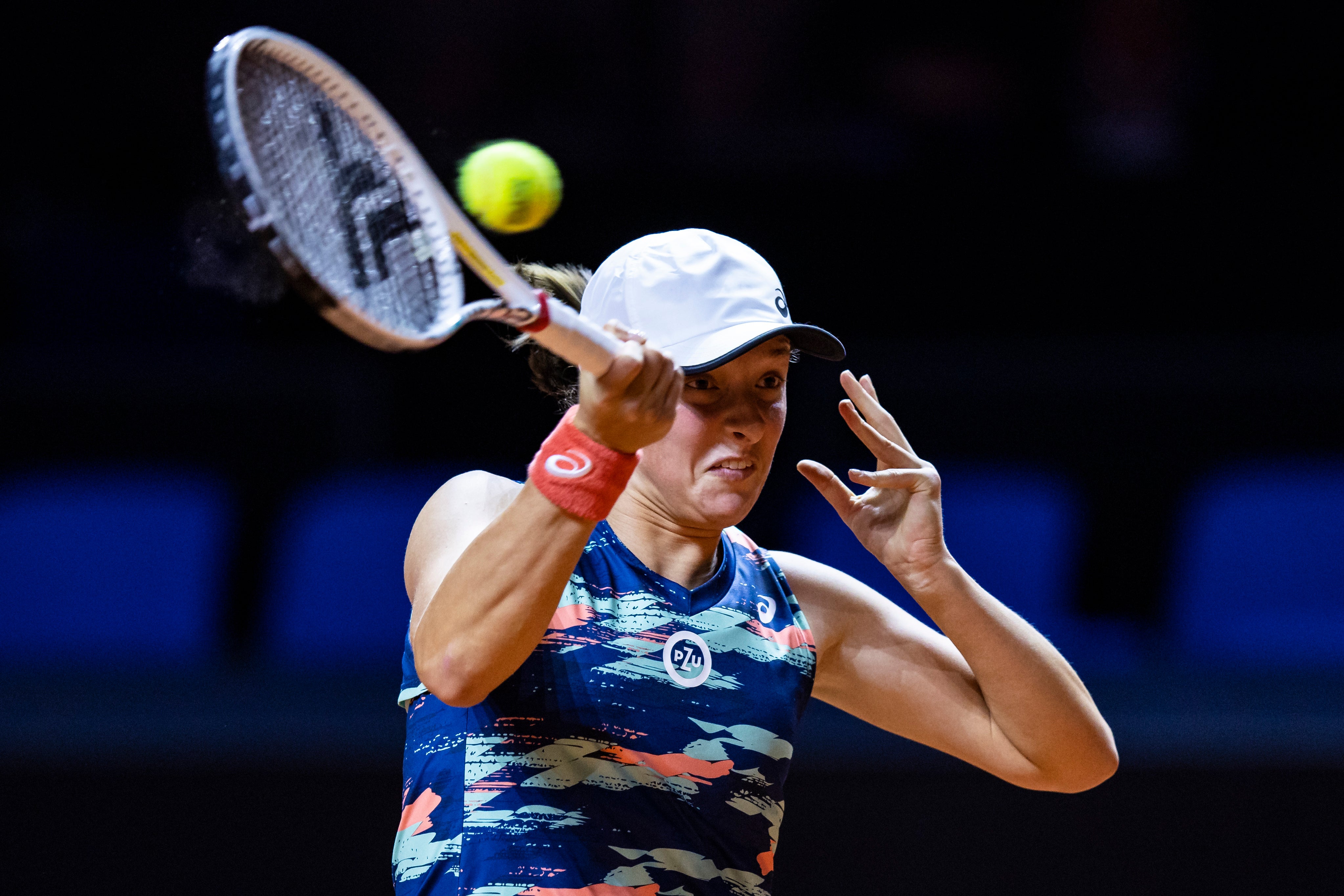 Poland’s Iga Swiatek returns a ball during her victory over Emma Raducanu in Stuttgart (Tom Weller/dpa via AP)