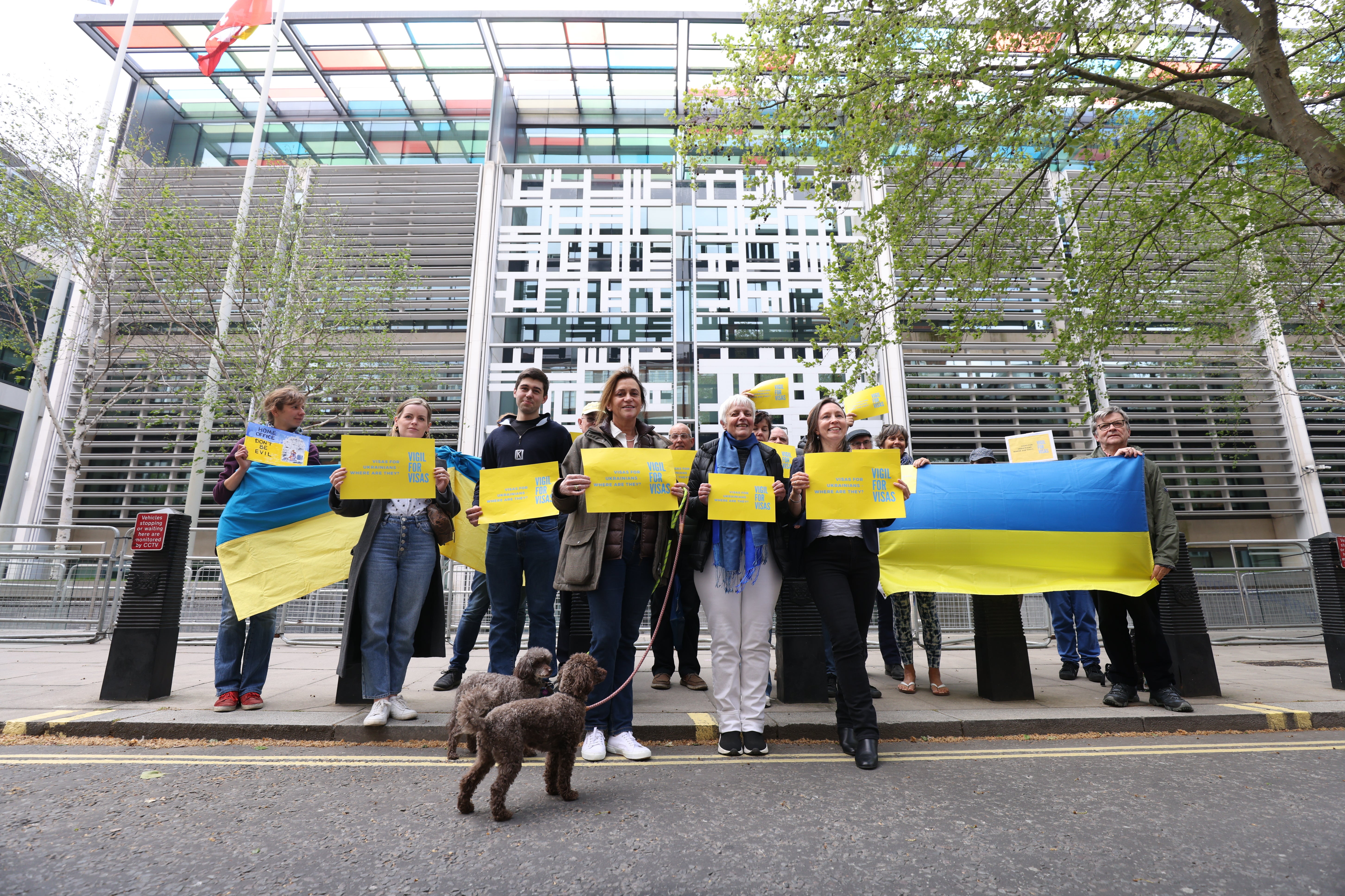 A group of would-be hosts, sponsors and supporters of Ukrainian refugees, hold a Vigil for Visas outside the Home Office in London (James Manning/PA)