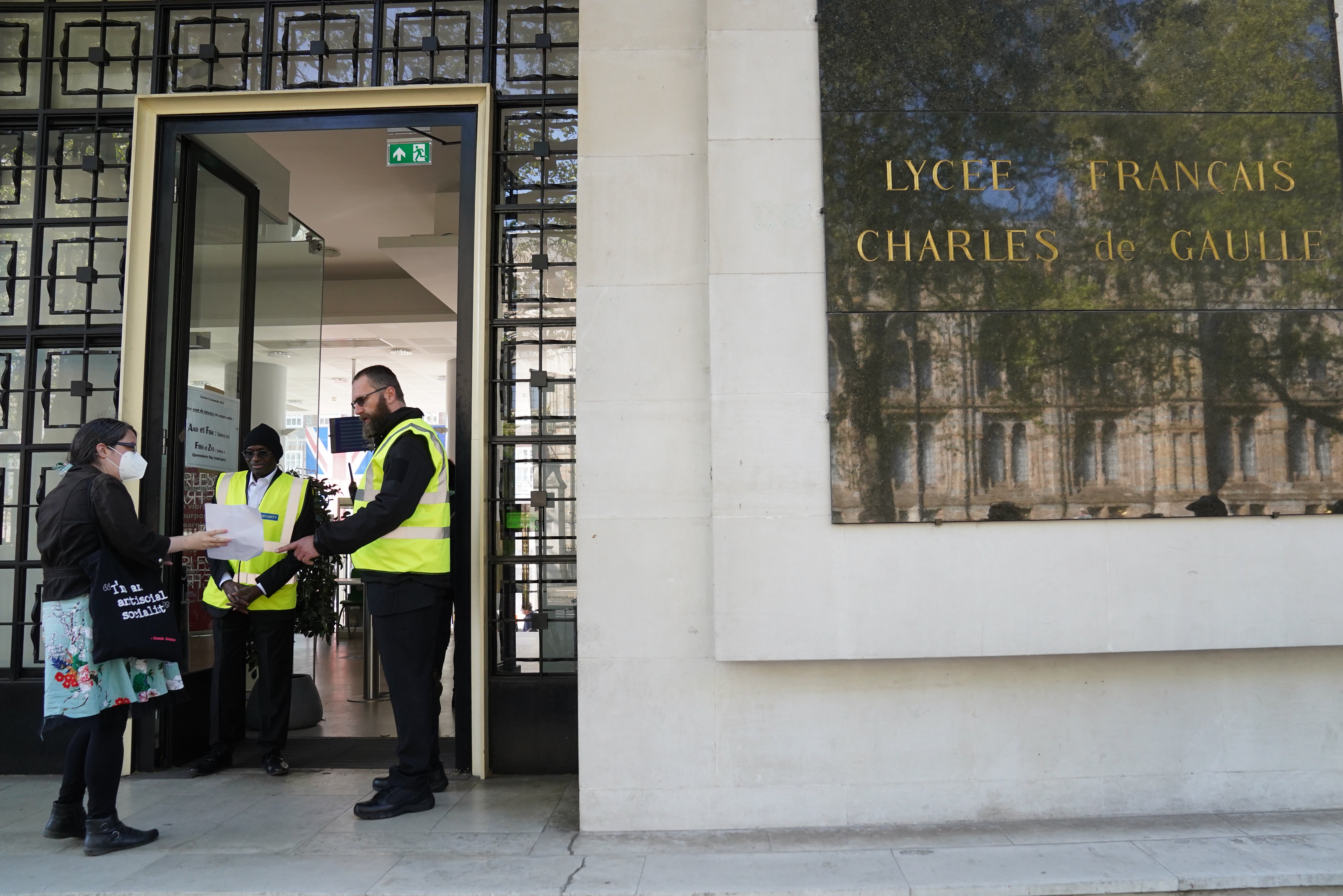 French nationals arrive to vote at Lycee Francais Charles de Gaulle in London, for the French presidential election (Stefan Rousseu/PA)