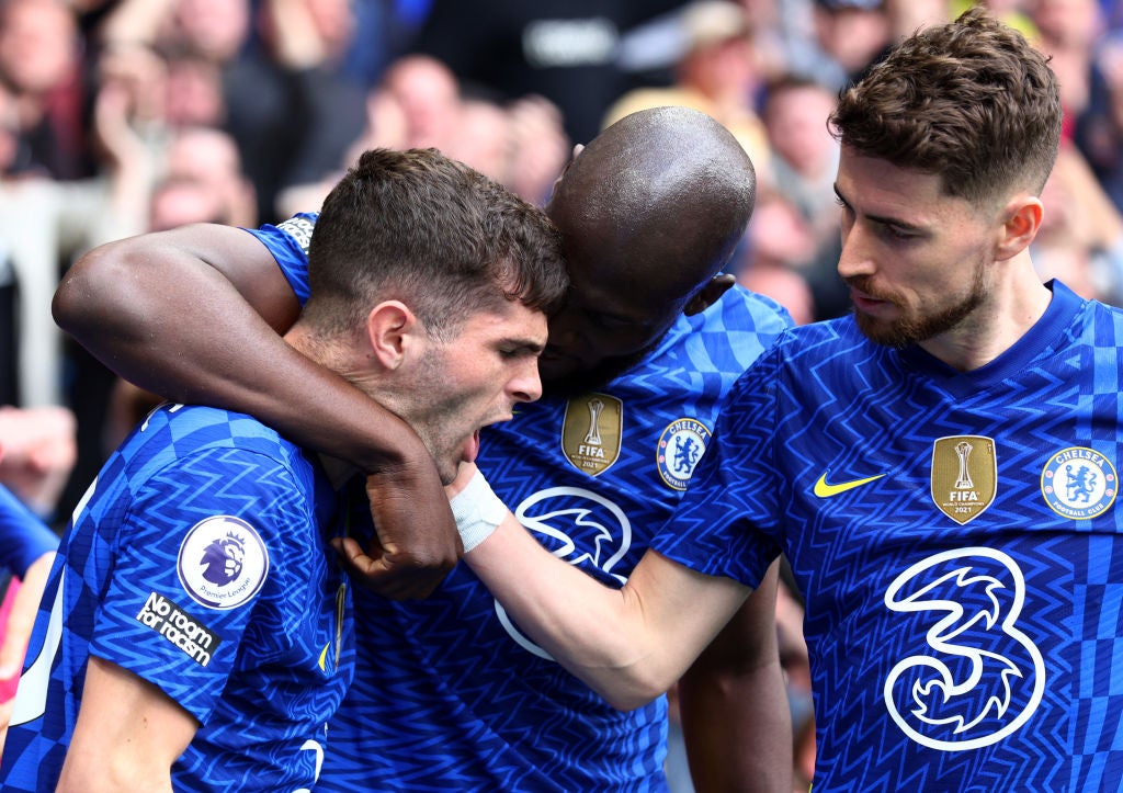 Goalscorer Christian Pulisic (left) celebrates with Romelu Lukaku and a relieved Jorginho (right)