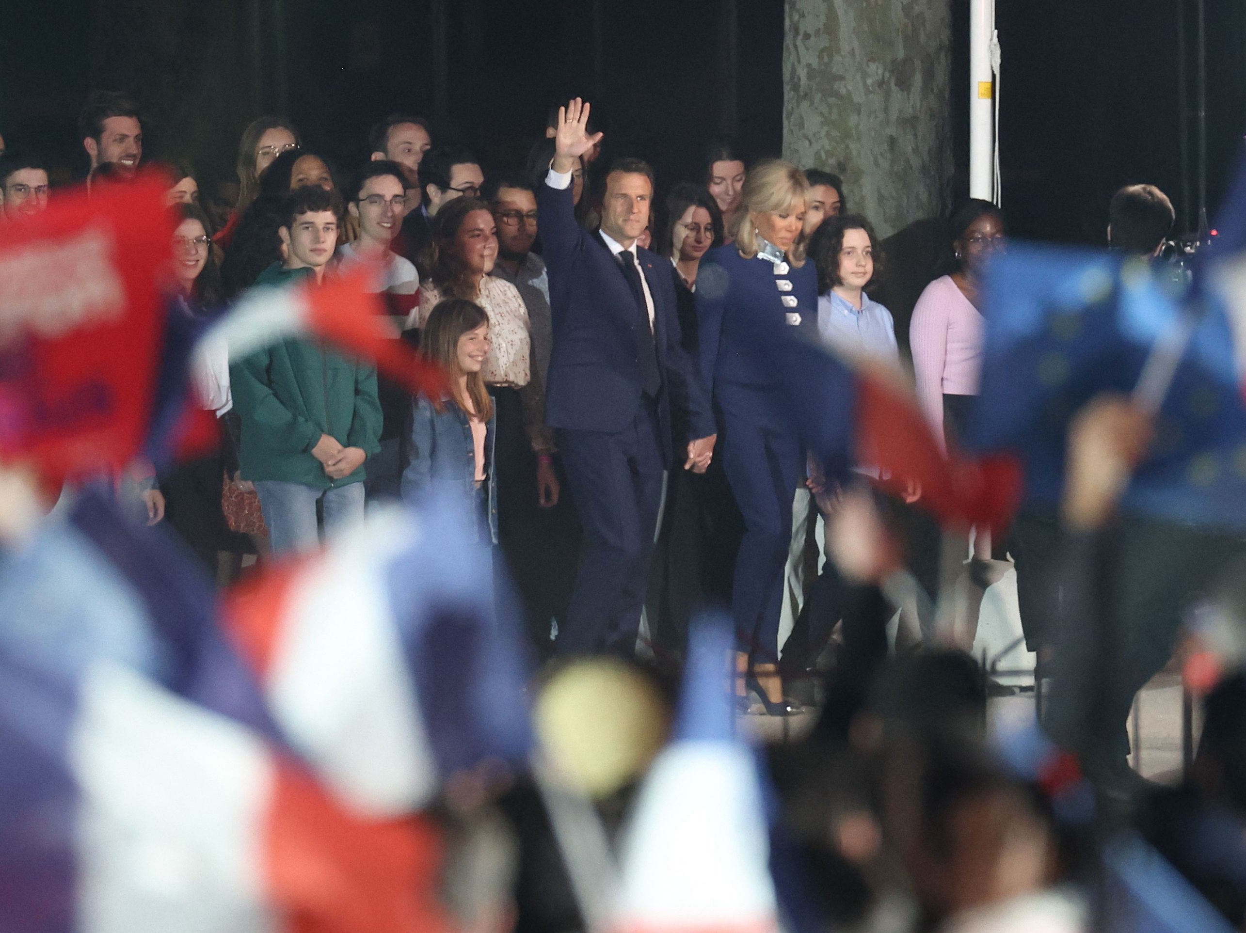 Emmanuel Macron and his wife Brigitte Macron arrive after his victory in France’s presidential election, at the Champ de Mars in Paris