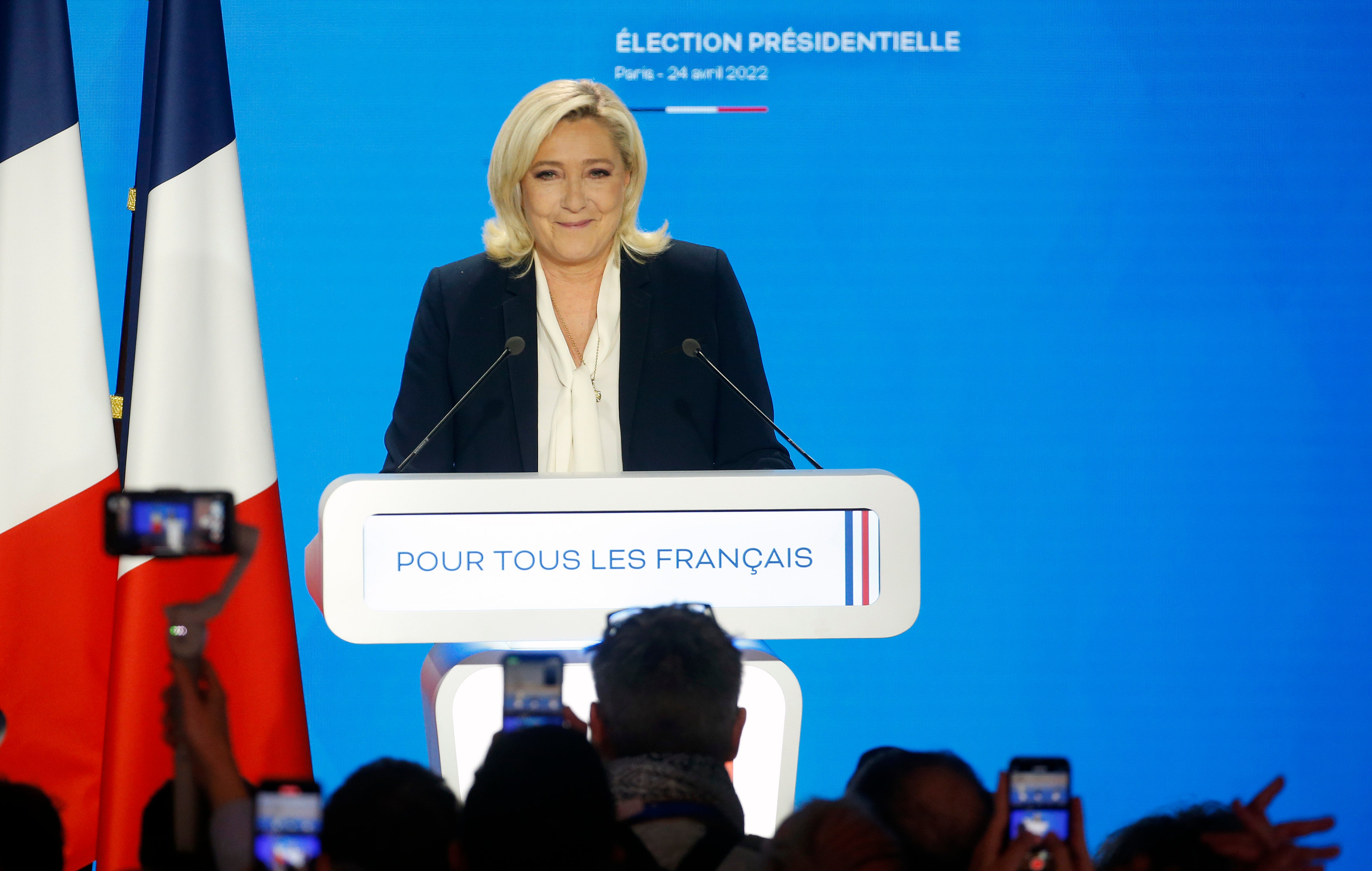 Marine Le Pen speaking to supporters after her predicted defeat